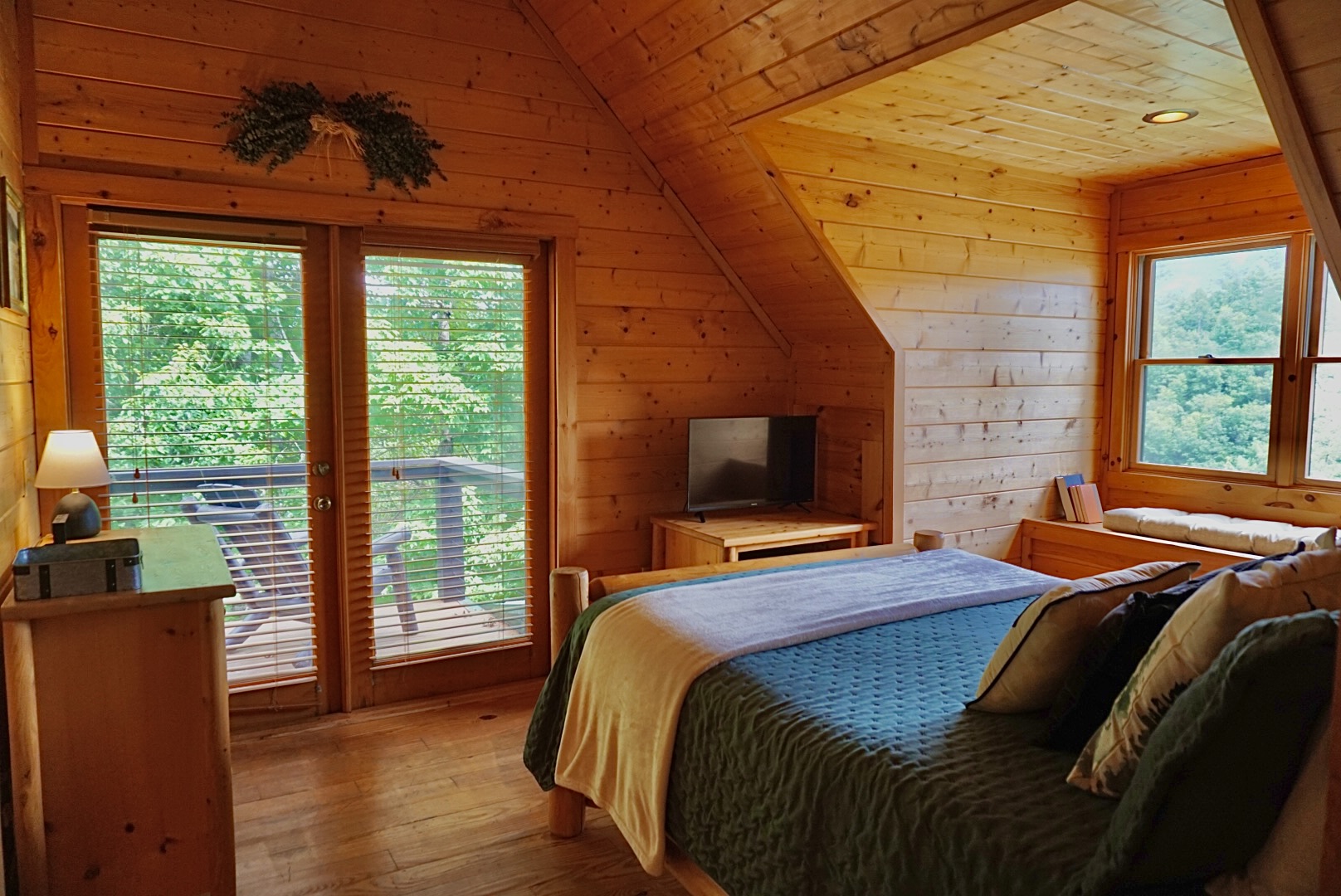 Escape the everyday. This charming bedroom offers a peaceful retreat with stunning views and a private balcony.