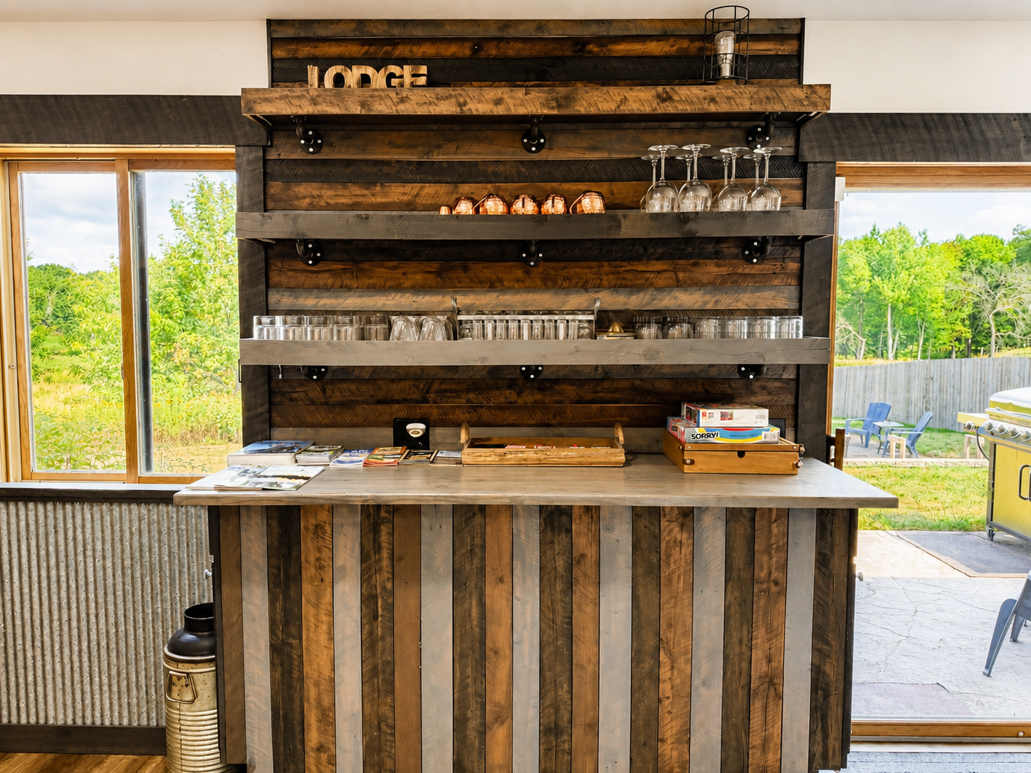 Rustic indoor bar and gathering area adds another fun place to relax, enjoy drinks, play games, and reconnect with your group after a full day on the nearby ATV and snowmobile trails.