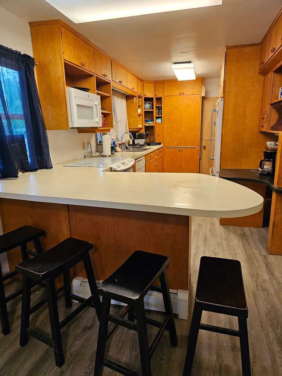 Full kitchen with stove, oven, microwave, refrigerator, and dishwasher. Plates, cups, silverware, pots, pans, and most essentials.