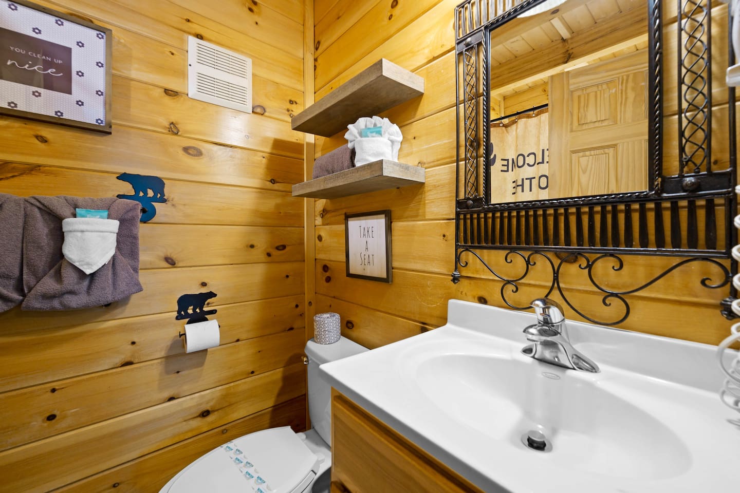Front bedroom's en-suite bathroom. Bathroom has a combination shower and tub.