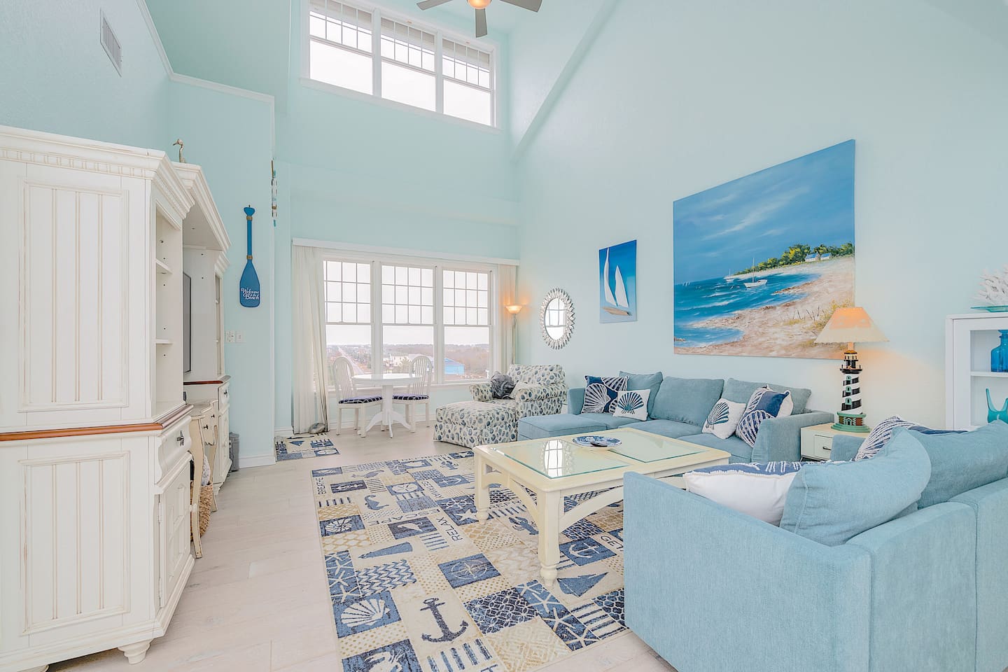 Light, bright, and beachy  Vaulted ceilings, coastal décor, and plenty of space to relax after a day by the ocean.
