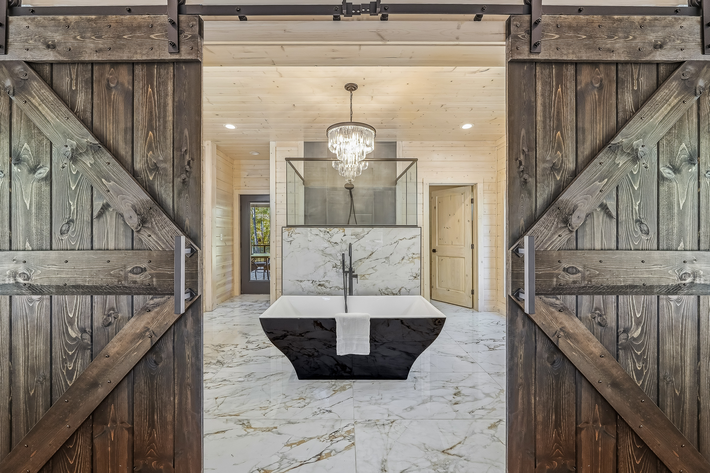 Your spa-inspired bathroom that feels like a private sanctuary. Soaking tub, marble finishes, and beautiful lighting welcome you in.