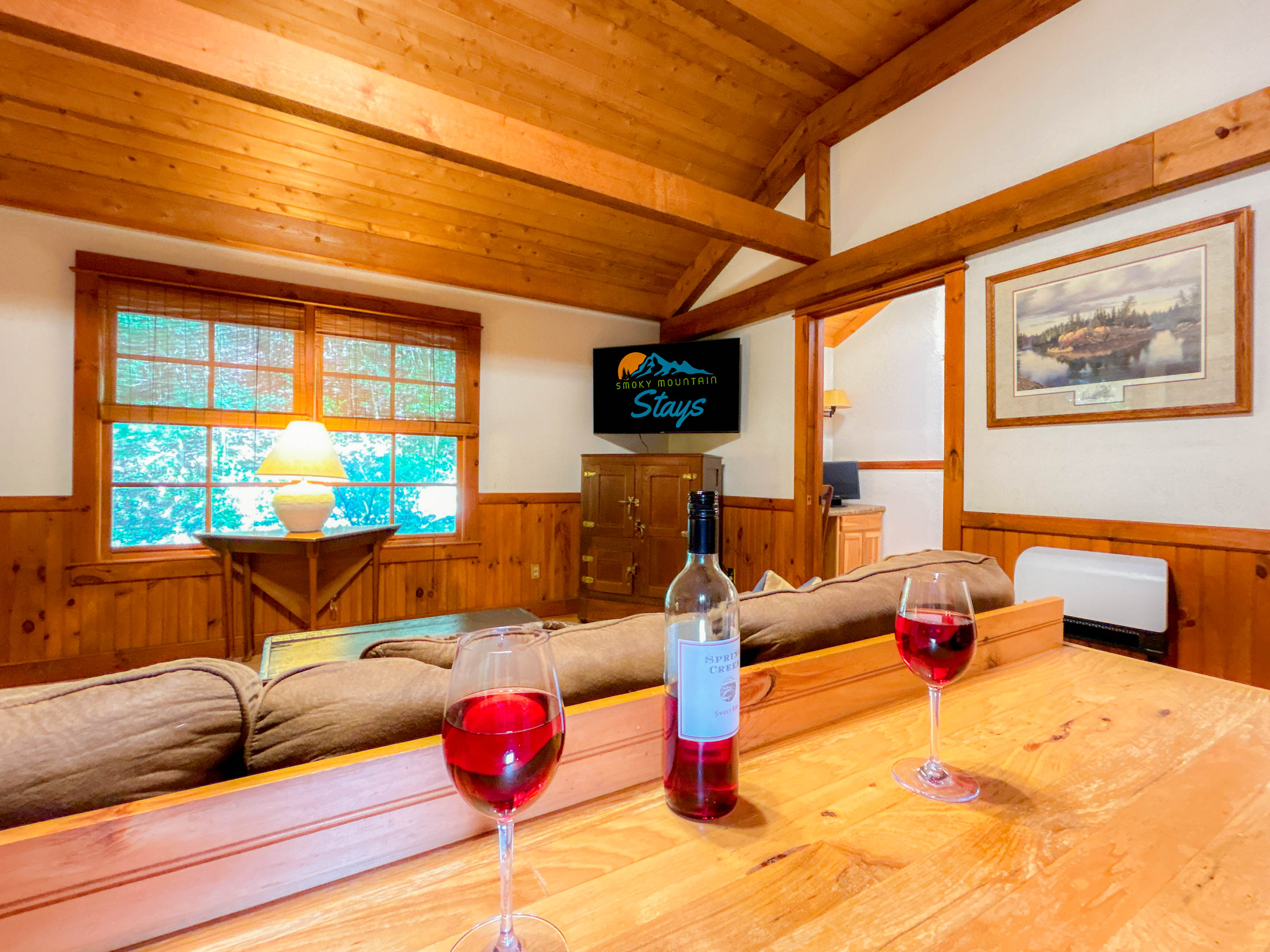 spacious living room complete with 50" smart-tv. 