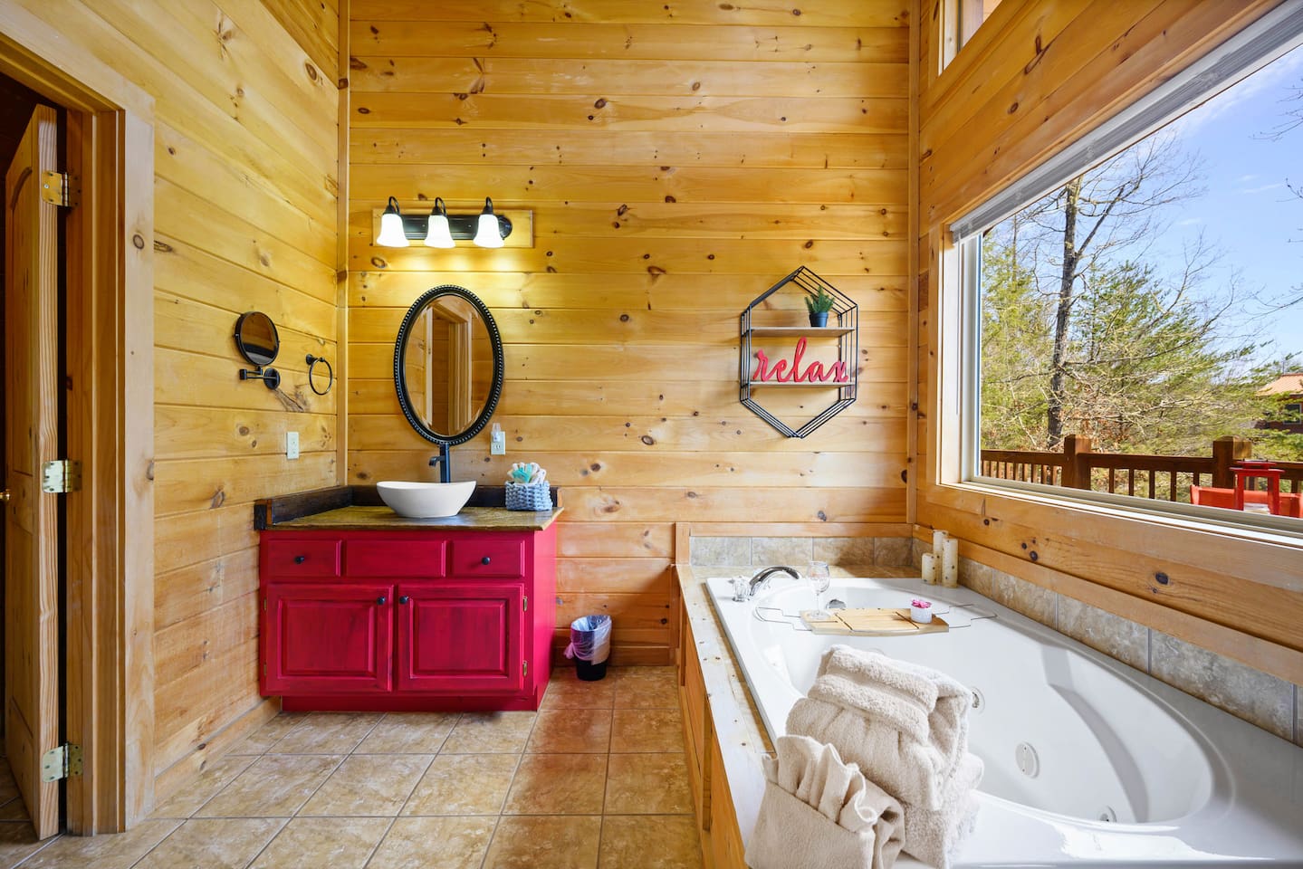Ensuite bathroom with sink and garden tub.