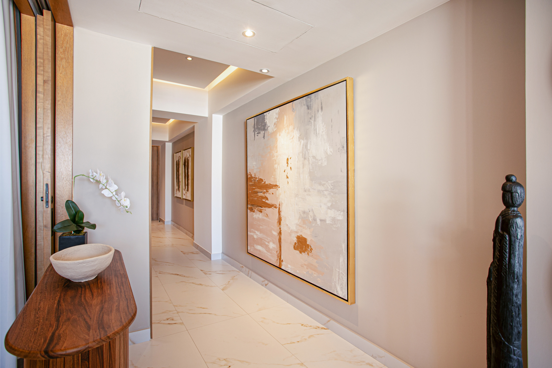 A clean, modern hallway connects each space seamlessly, creating a welcoming flow throughout the condo.