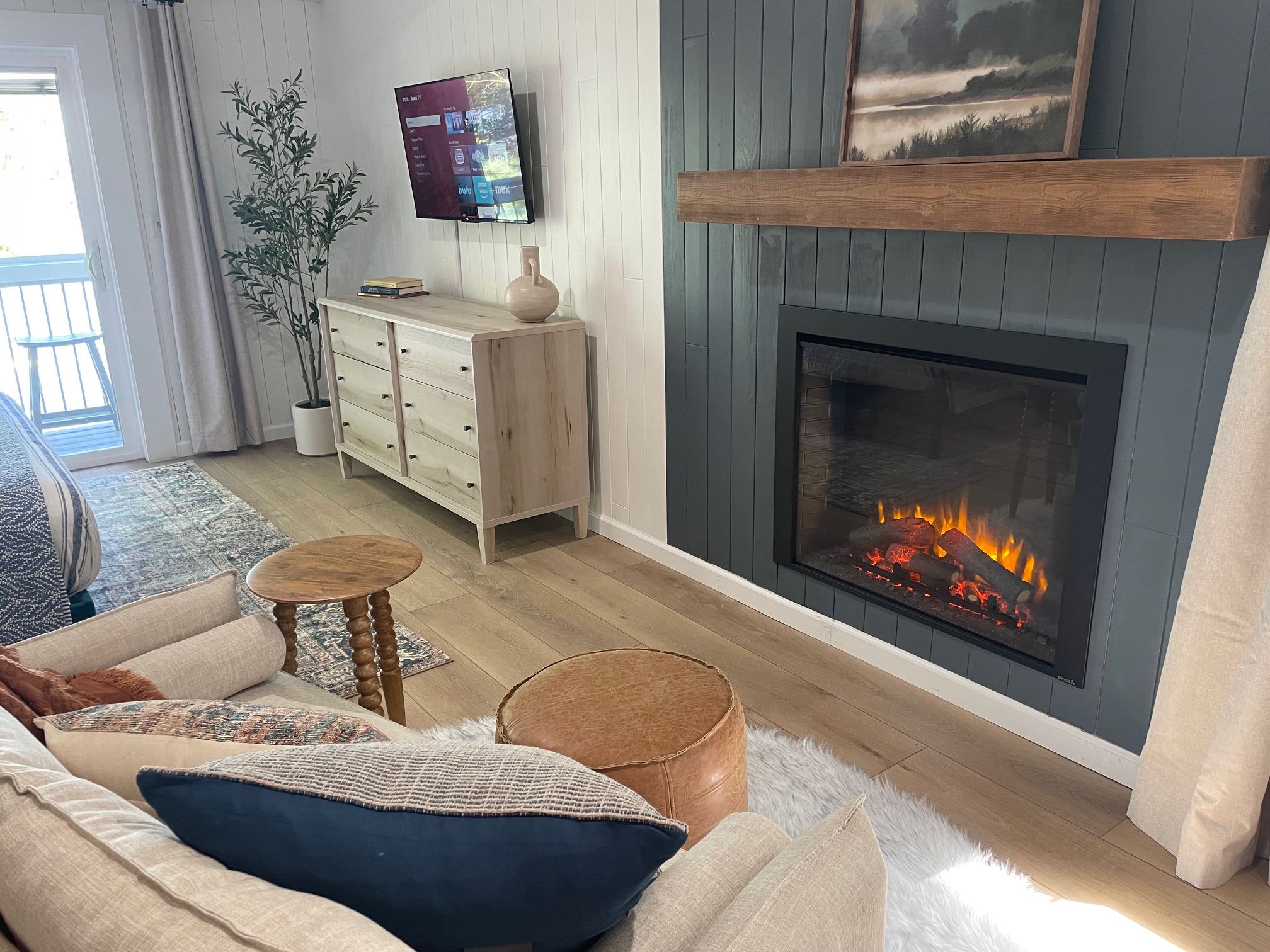 Curl up with a book on the couch in front of the electric fireplace