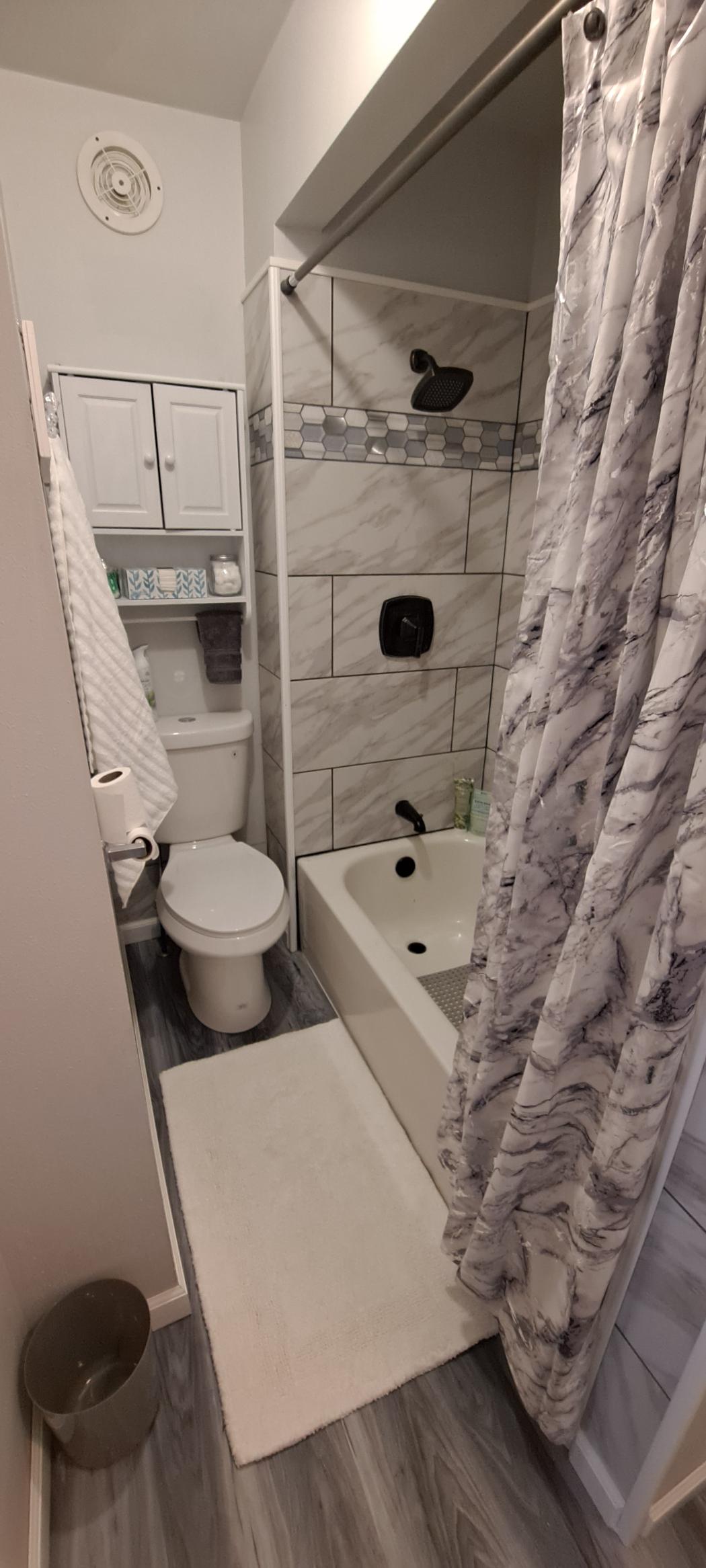 Spa-like bathroom with deluxe amenities and tub