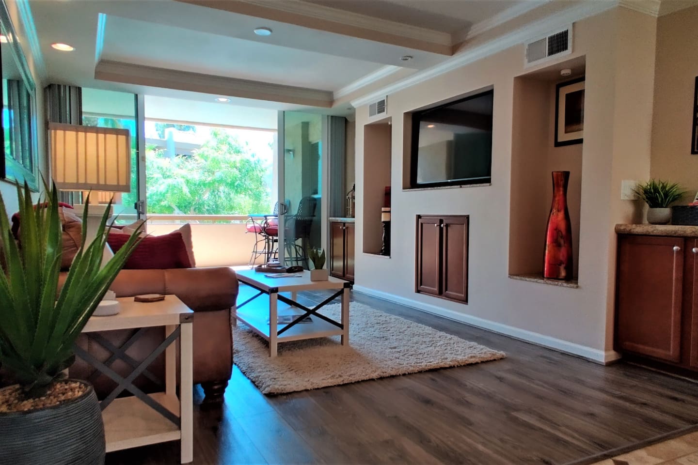 A myriad of entertainment options including a 55" 4k Roku TV, Cox Contour Cable with Showtime, a Blu-Ray player, and an Amazon Echo Dot with Alexa services. Open the balcony doors for true indoor/outdoor living.