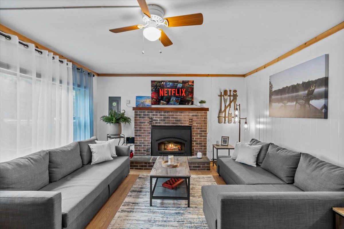 Cozy living room with fireplace, smart TV and comfy couches