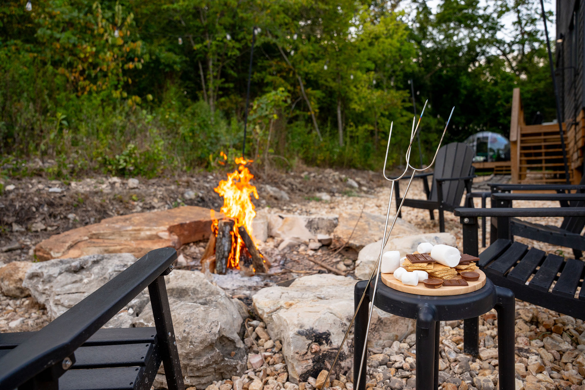 Gather around the natural stone firepit after the sun goes down.