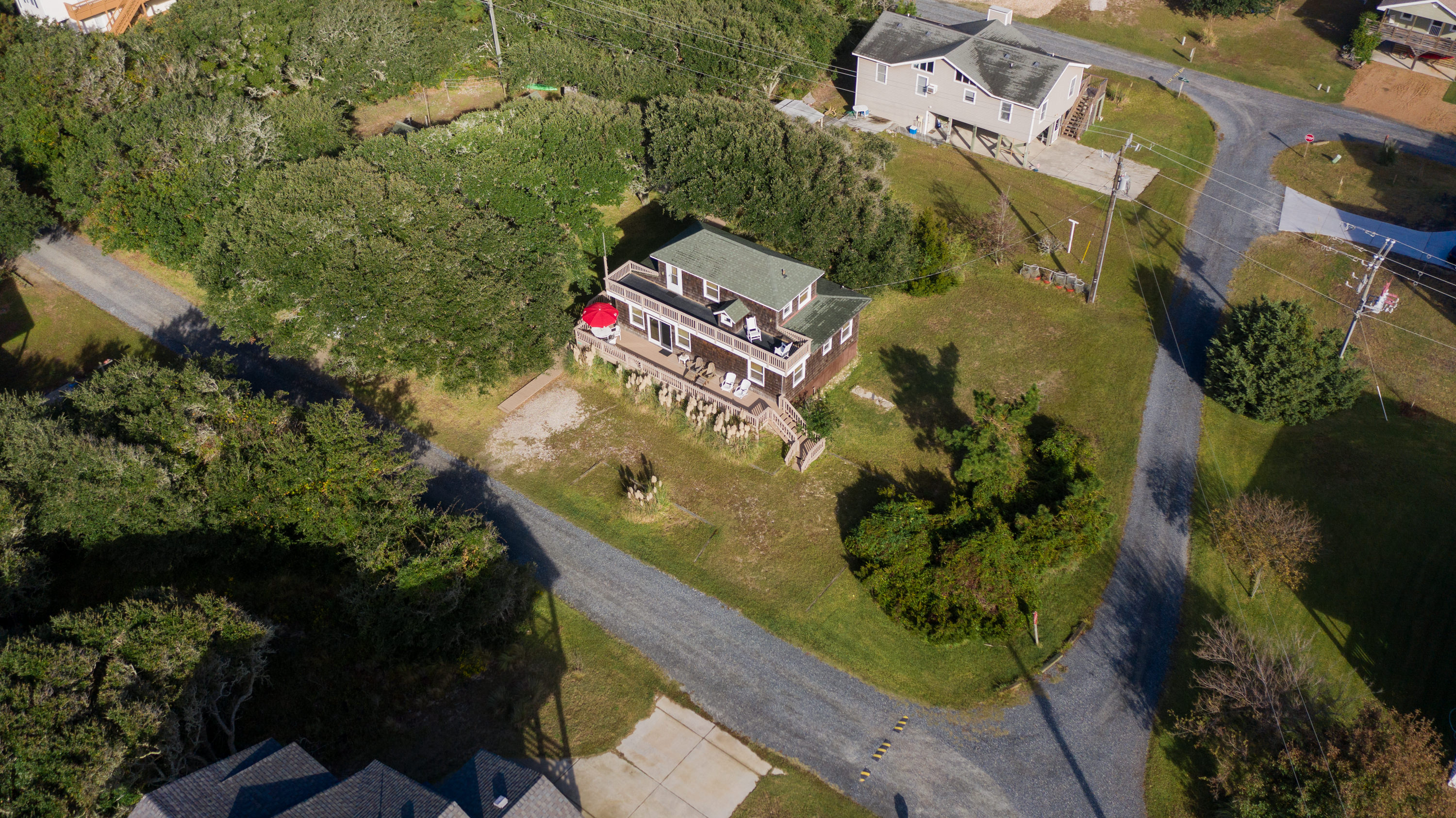 Situated in one of Ducks oldest neighborhoods, it feels like you have stepped back into time.  Welcome to the Original Outer Banks - gravel roads and windswept trees.