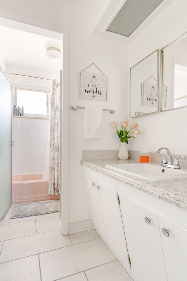 Main bathroom with tub and shower