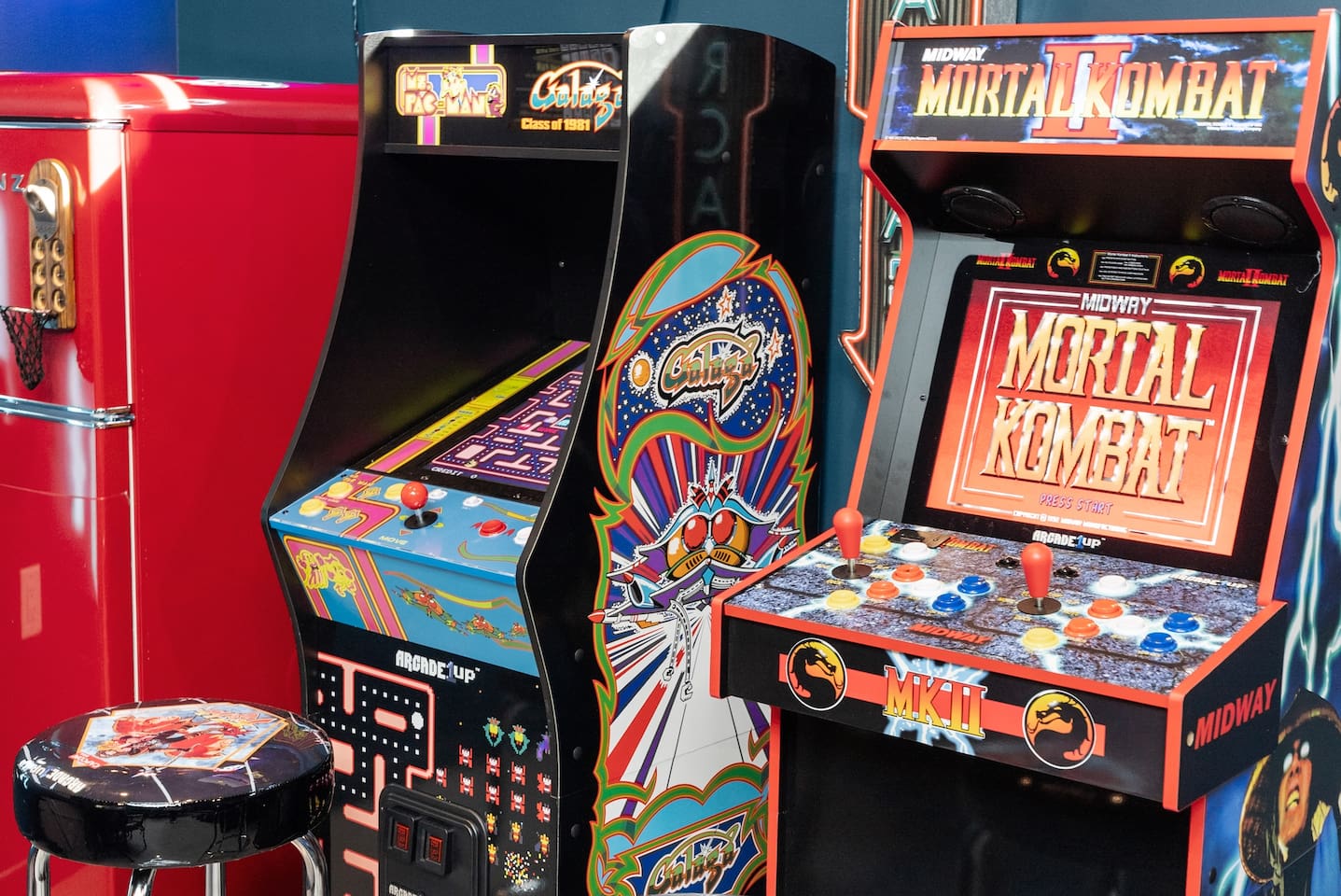 Convenient red fridge in the garage, located next to the arcade—perfect for snacks and drinks during game time.