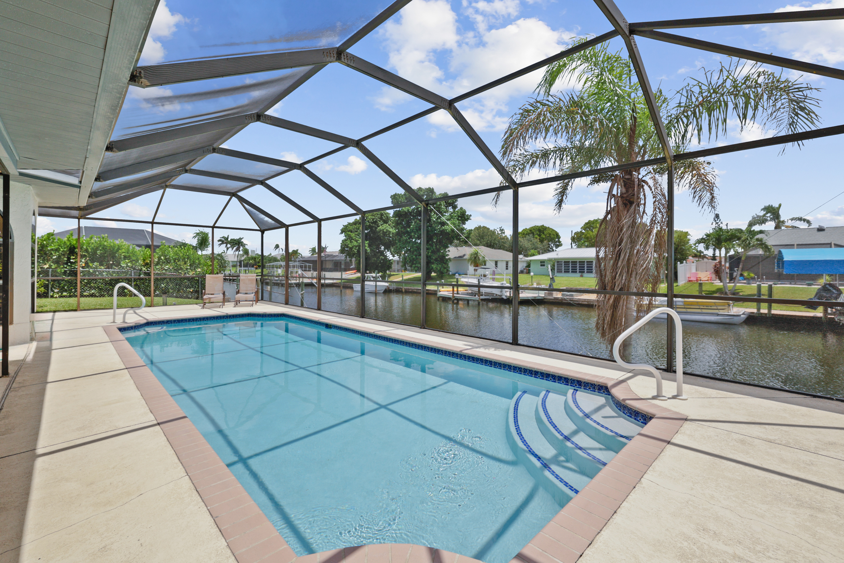 Heated pool with a canal backdrop