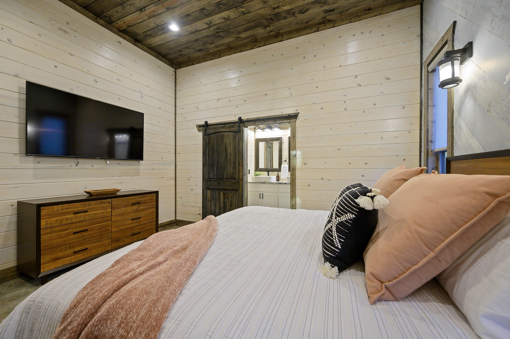 A cozy retreat wrapped in warm wood tones and soft lighting — unwind, recharge, and let the forest calm settle in.