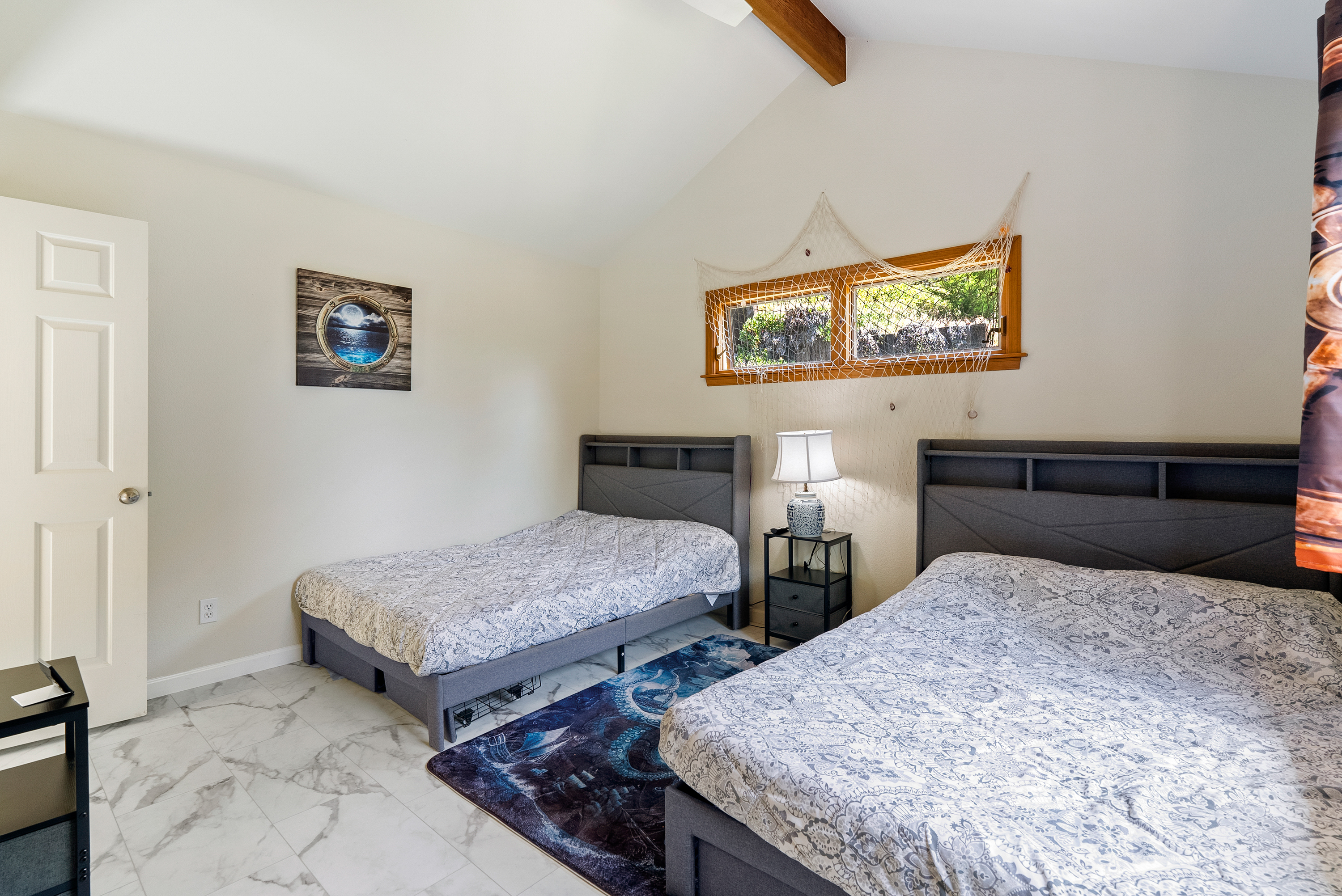 Enjoy spacious flexibility in this bright hillside retreat.