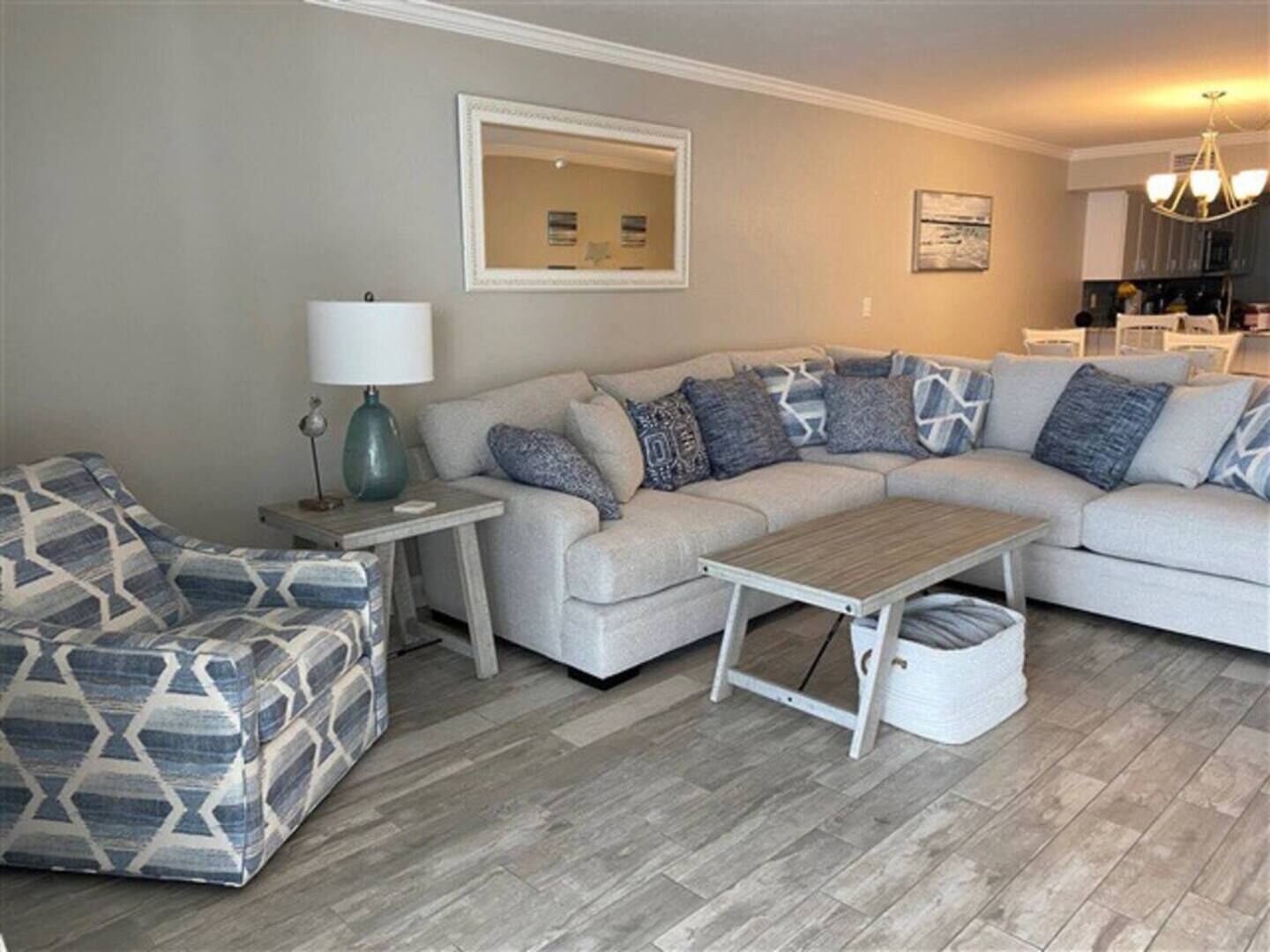 sectional in living room with ocean and beach views.
