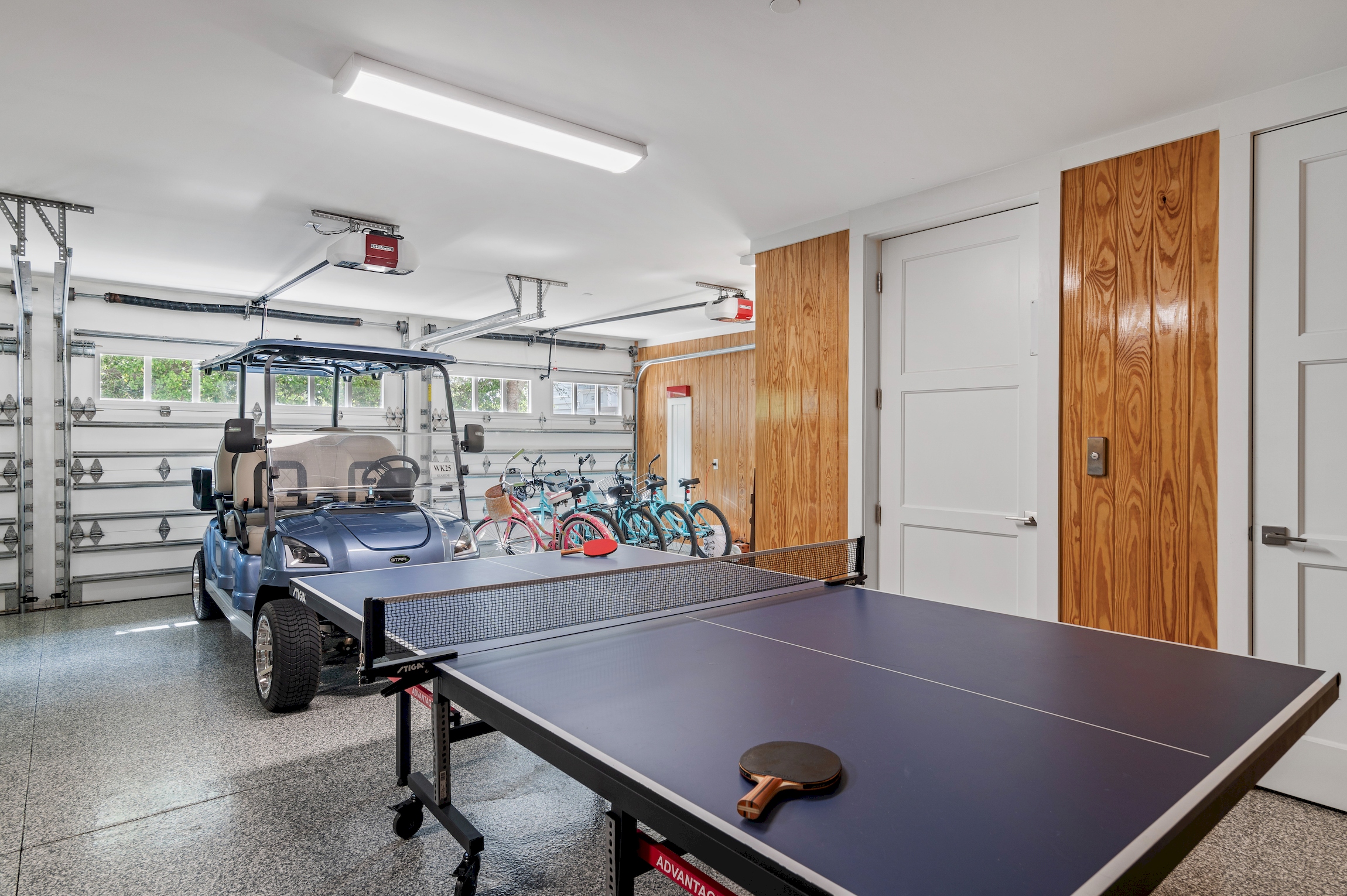 Climate controlled garage offers ping pong, bike and beach toy storage, and easy no-step elevator access.