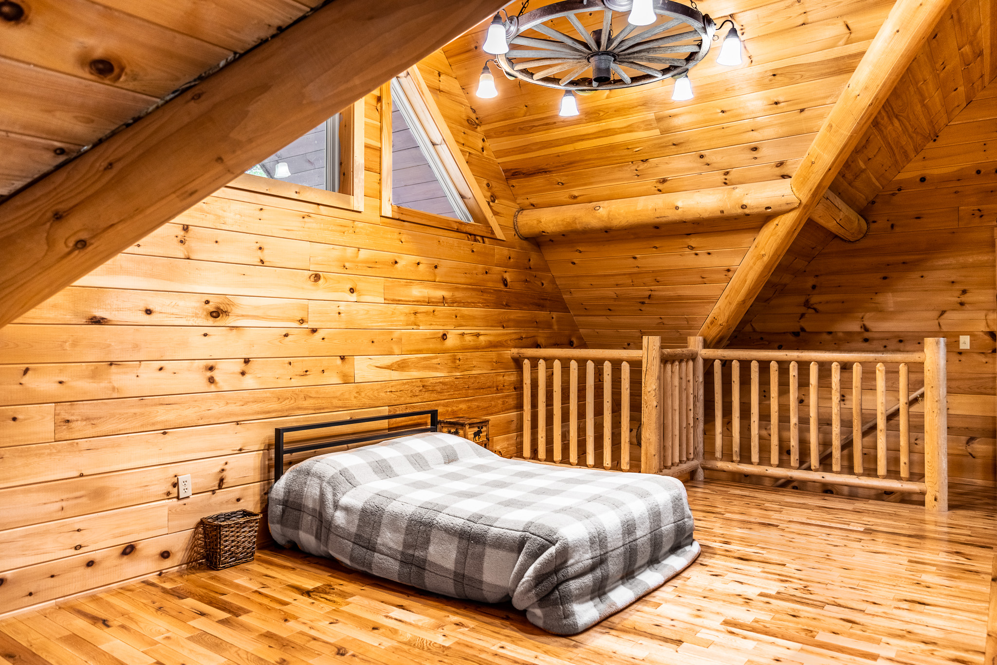 Loft with full bed hidden on top floor behind the huge fireplace. Great spot for kids to sleep while still keeping an eye on them.