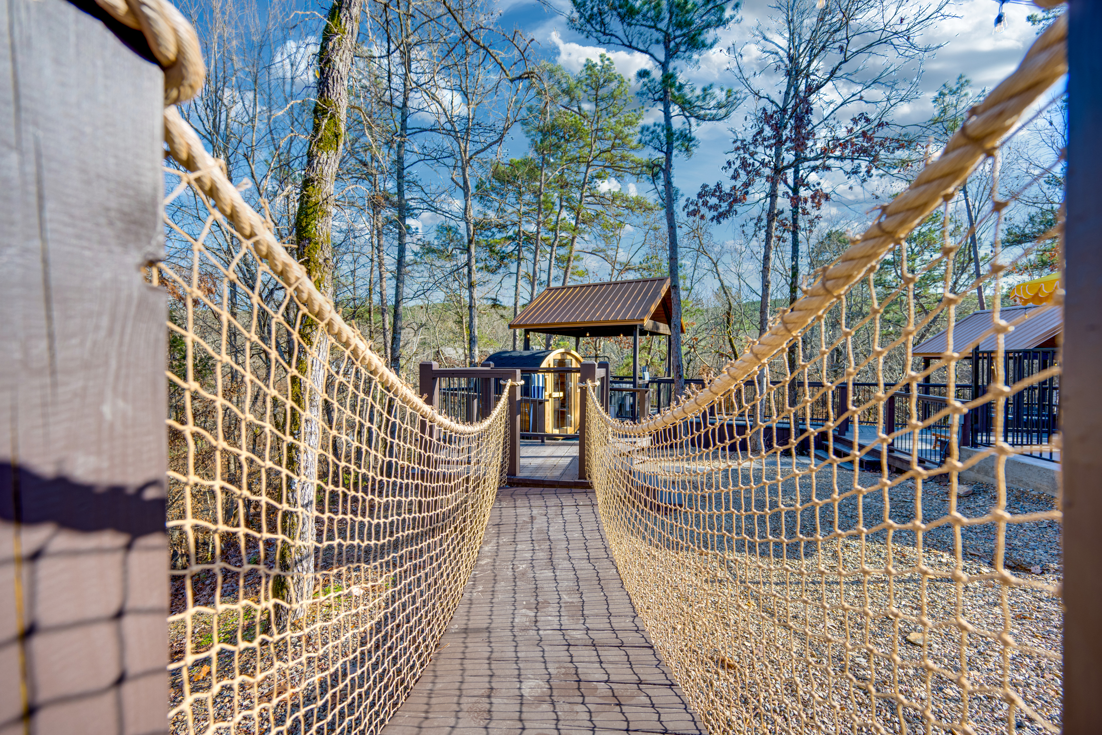 Play Area: Adventure awaits! Enjoy the rope bridge leading to fun-filled outdoor activities!