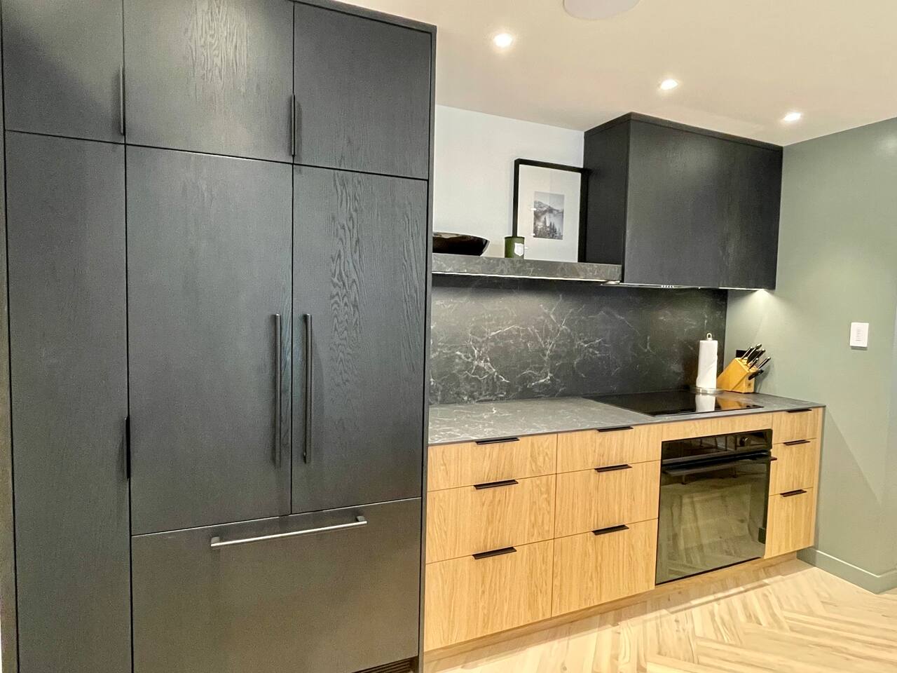 Large capacity Fisher Paykel Refrigerator anchors this spacious chef's kitchen  