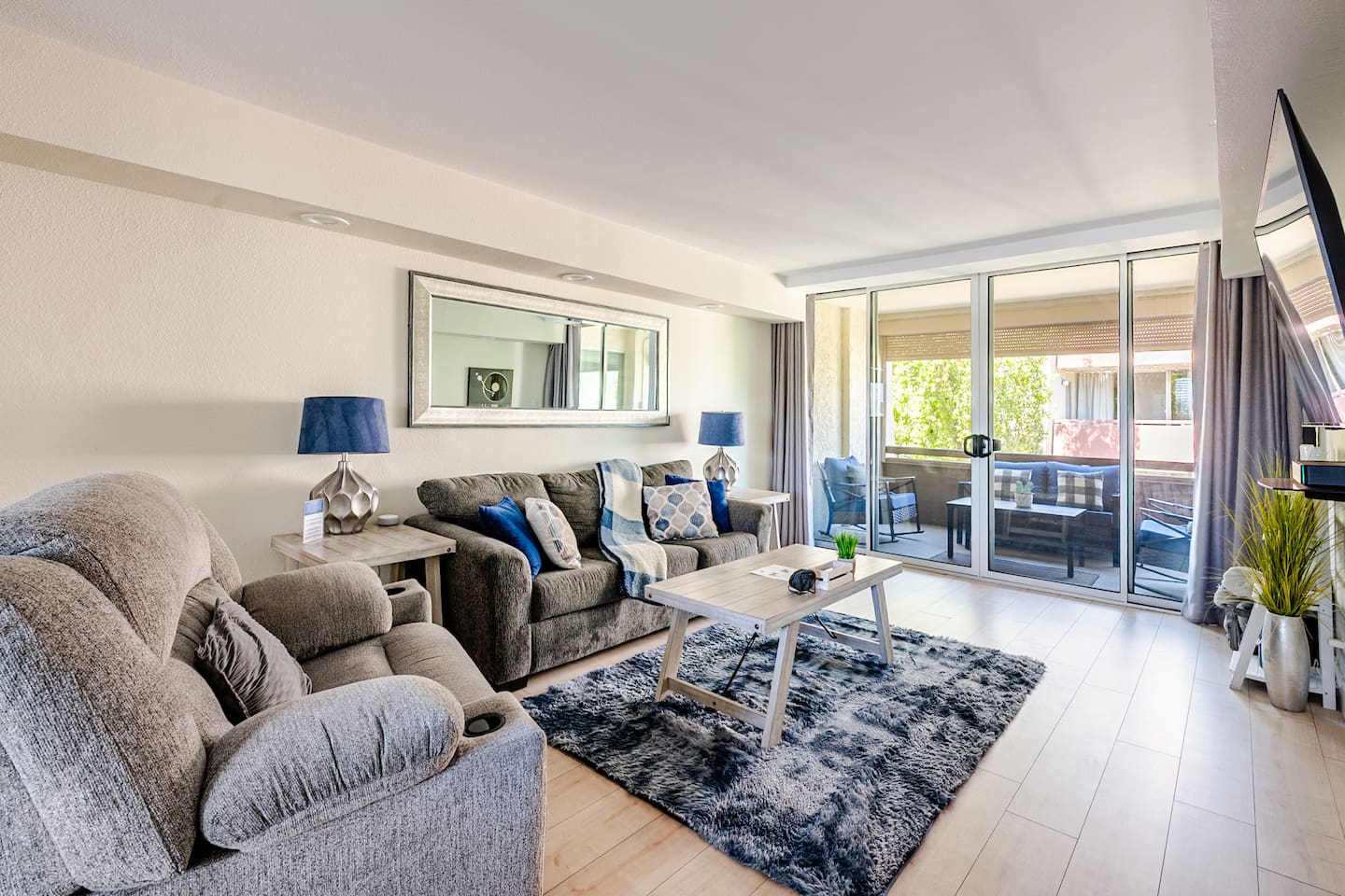 Relaxing living room includes queen sleeper sofa with memory foam mattress.