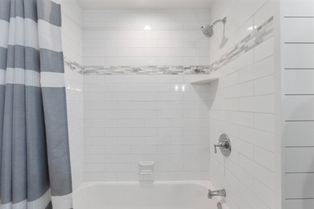 Full bathroom with shower and tub combo