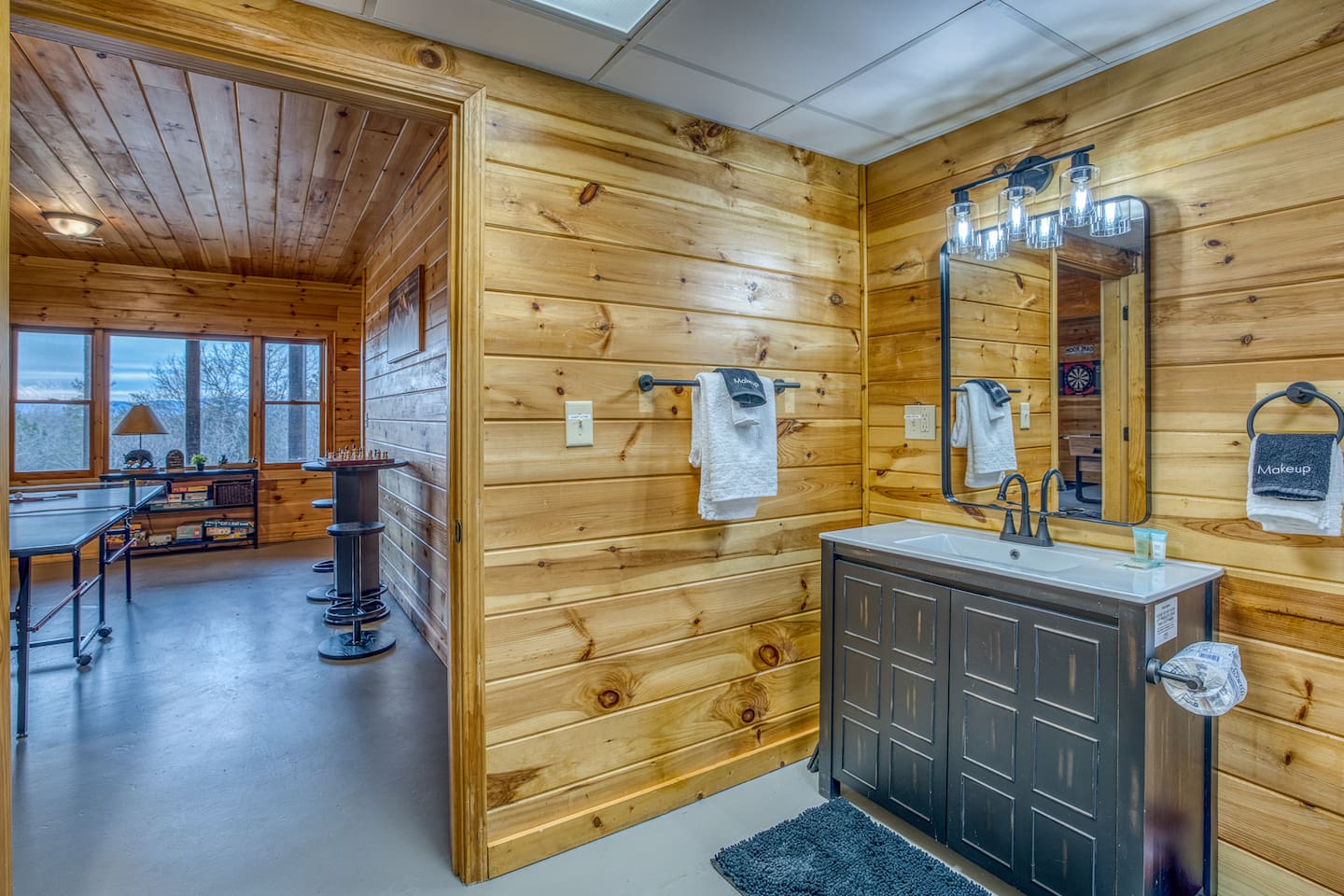 Full bathroom in the basement with sink, toilet and tub - right off the game room!