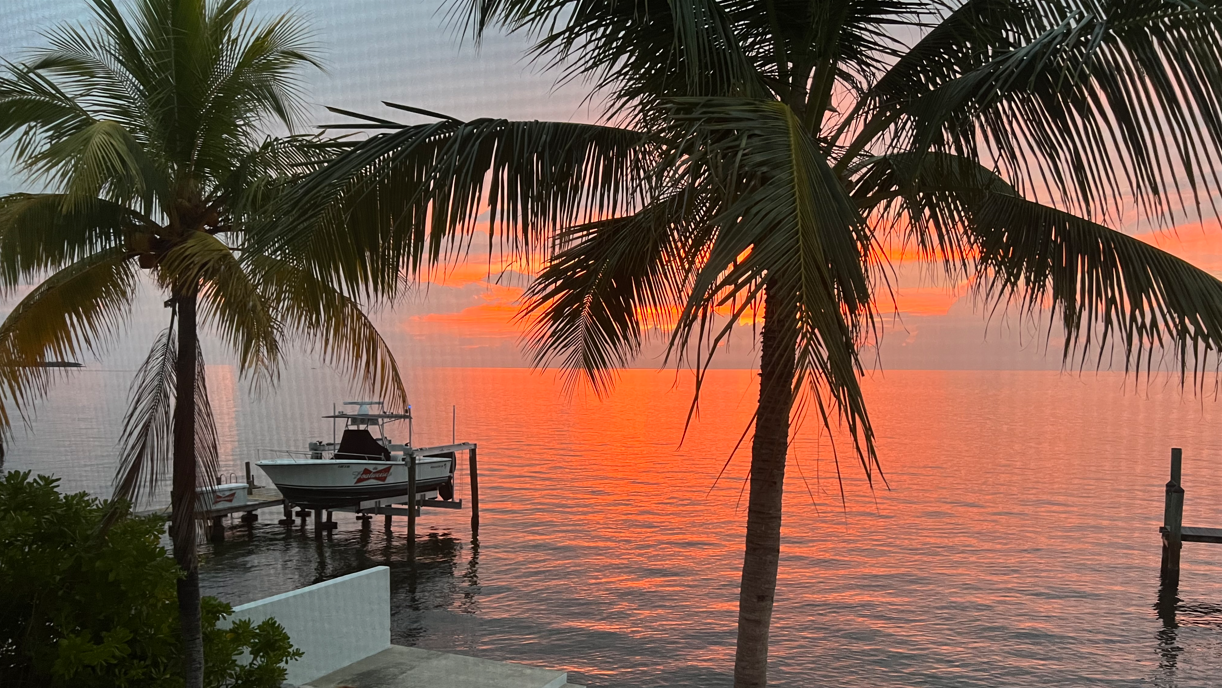 View Breathtaking Sunsets from the Screened-In Porch