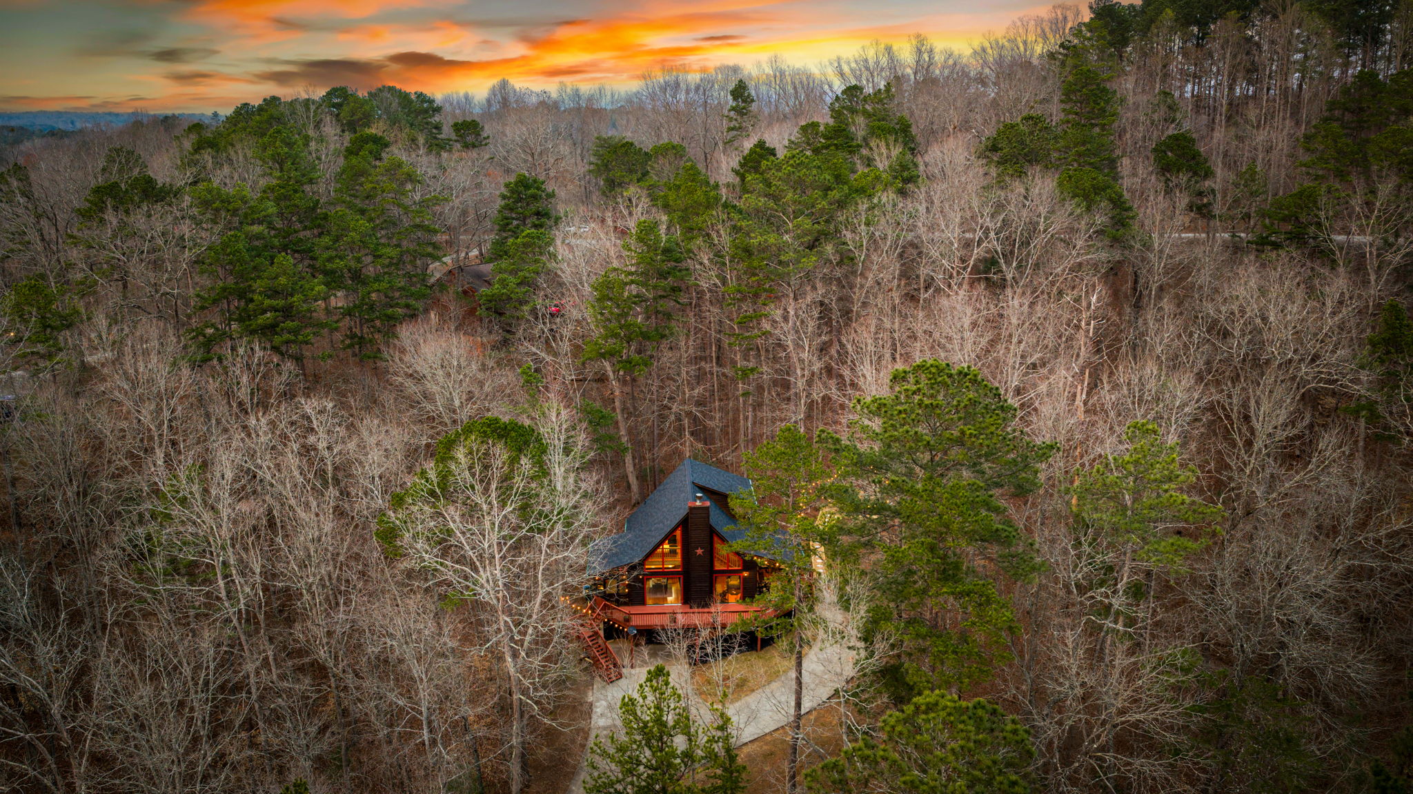 Towering trees frame the property, adding both privacy and a sense of tranquility.