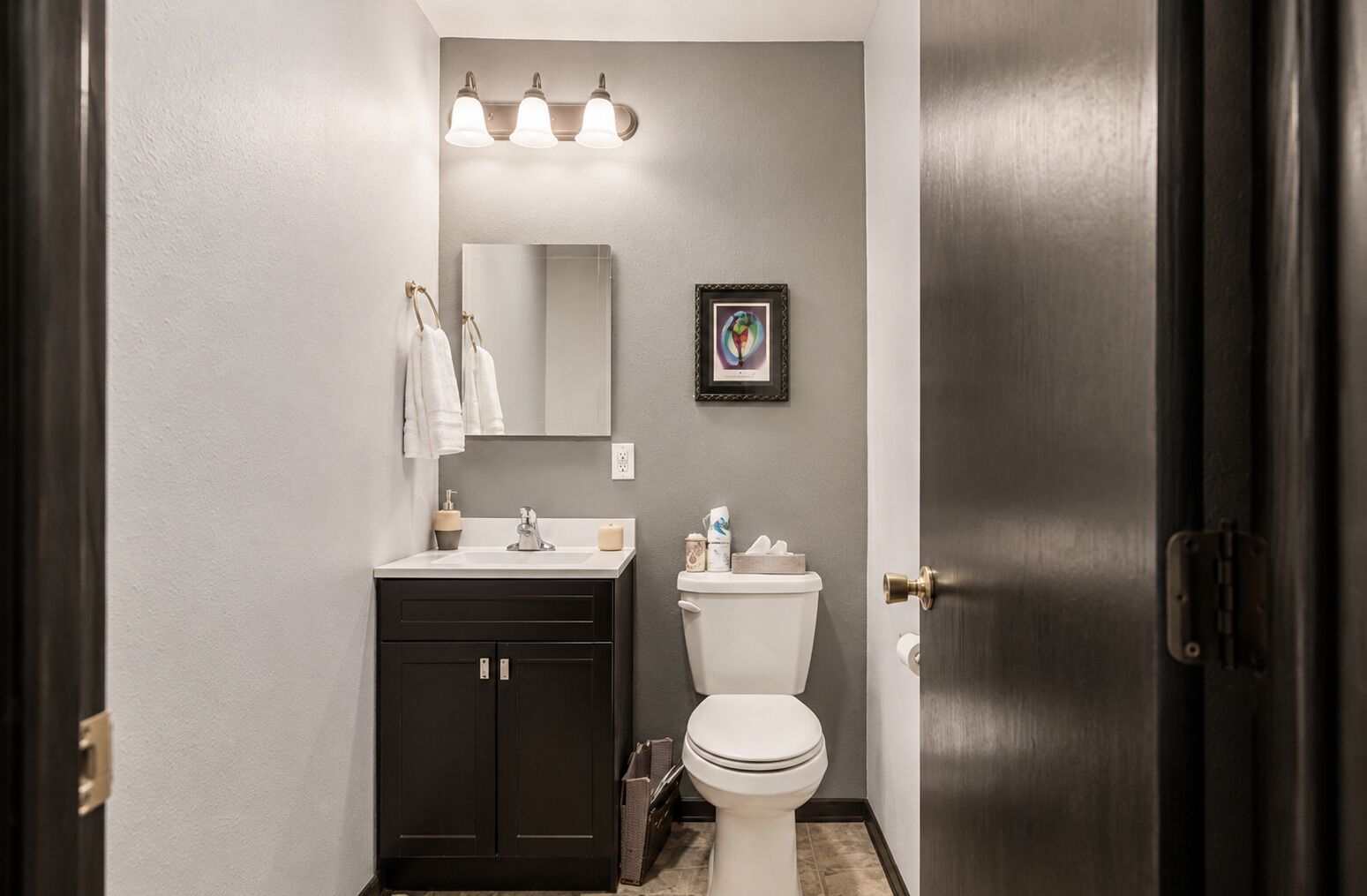 An additional upper-level half bath adds convenience and comfort during your stay.