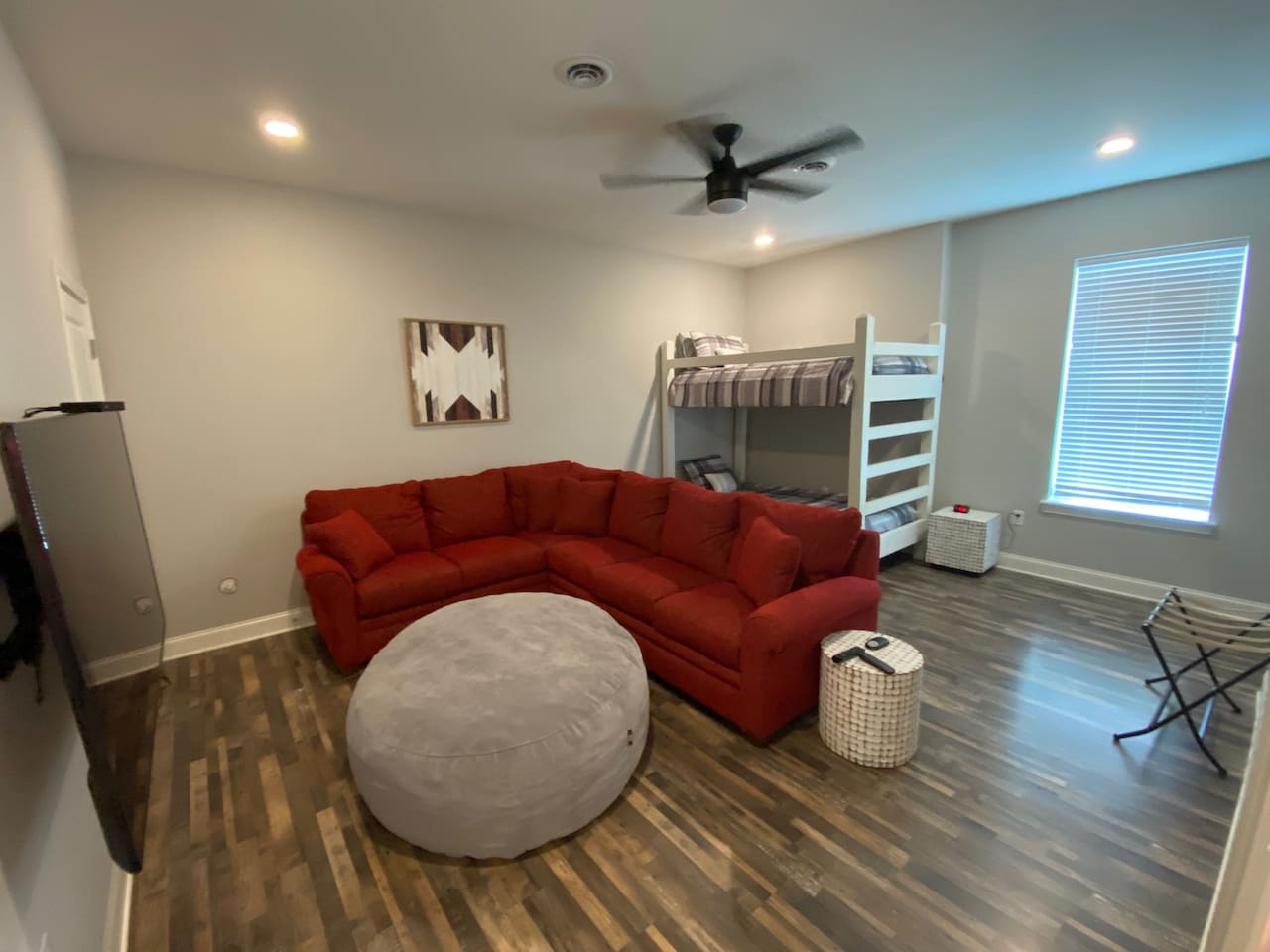 Large kid room/2nd living room with 2 twin bunk beds.