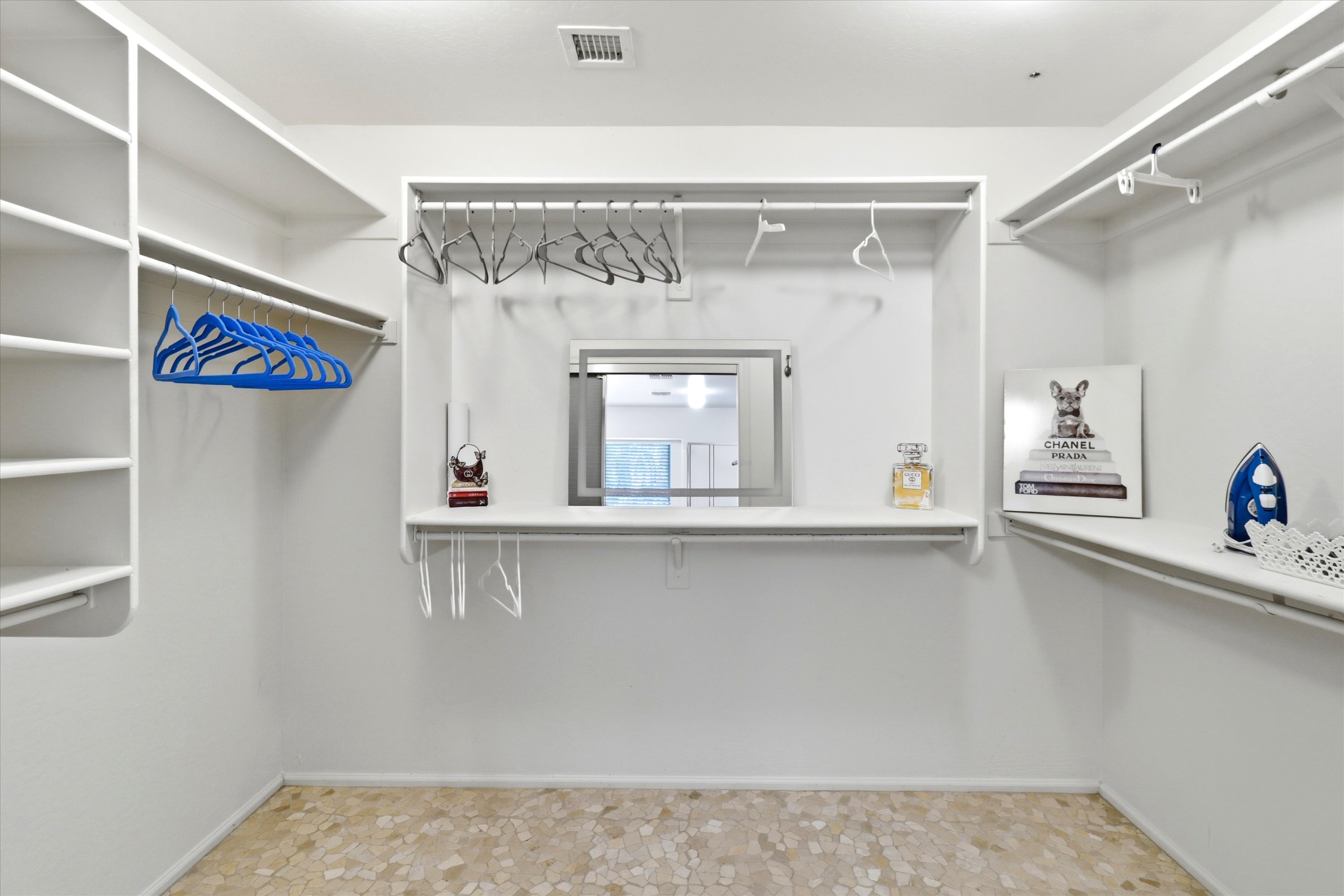 Walk-in closet with hanging space, shelves, and room to unpack during your stay.

