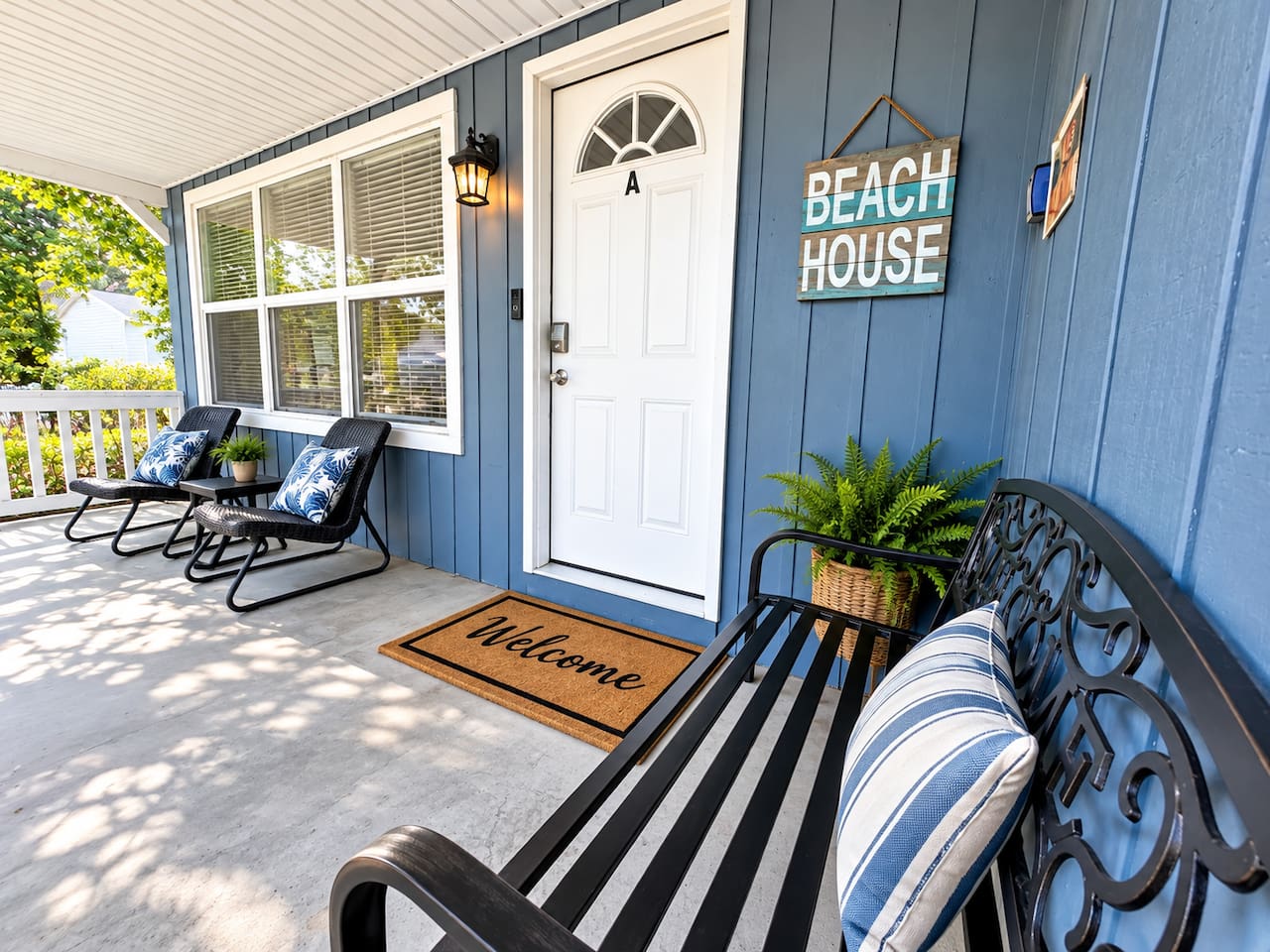Porch Retreat: Enjoy serene mornings soaking in the sun on stylish seating with beachy vibes!