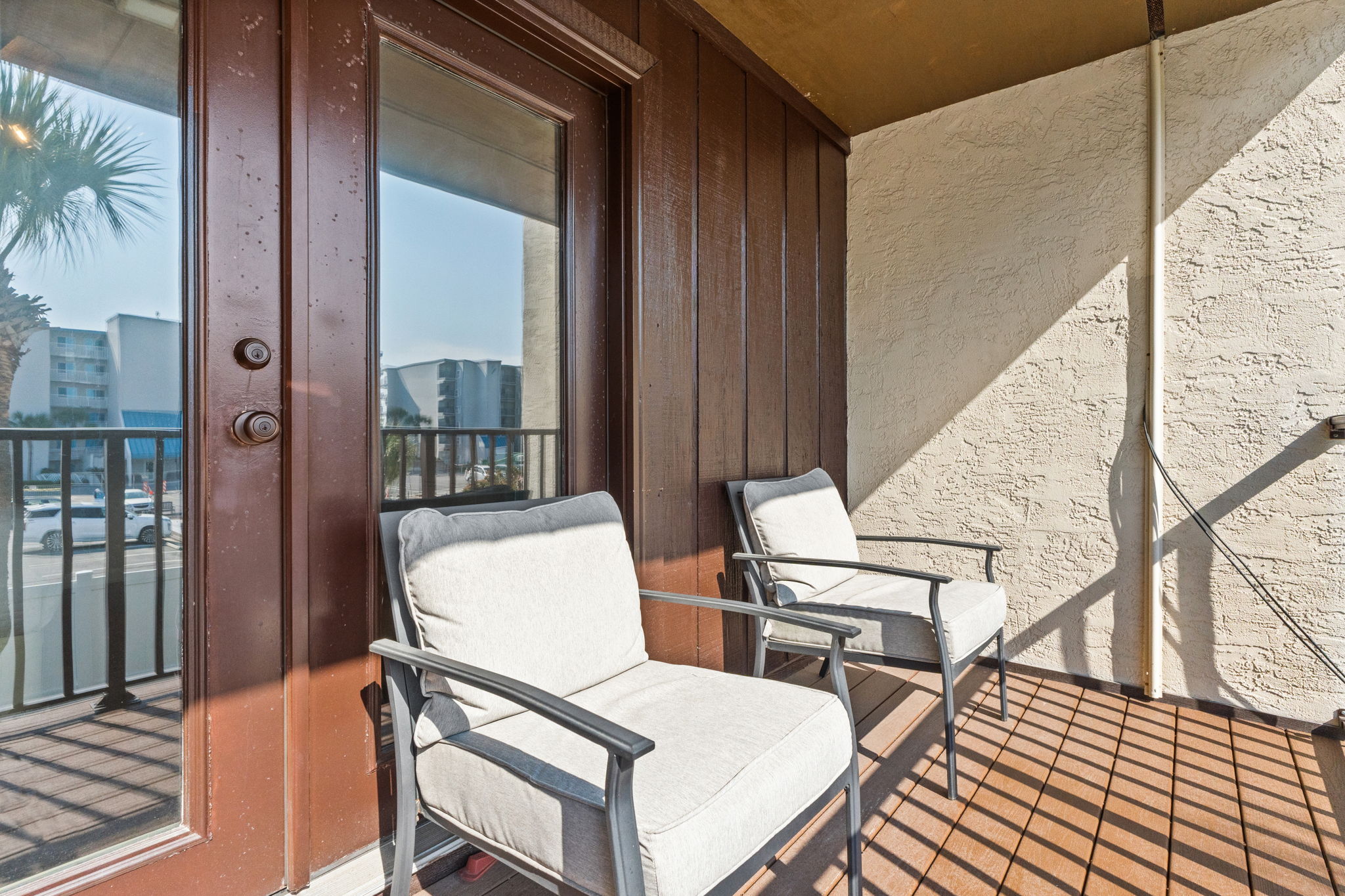 Balcony off of Bedroom 1 with outdoor seating