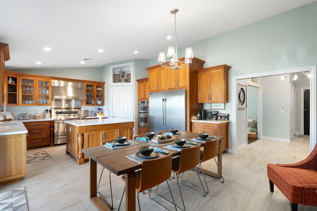 Chef's kitchen complete with 3 ovens, and commercial refrigerator and freezer.