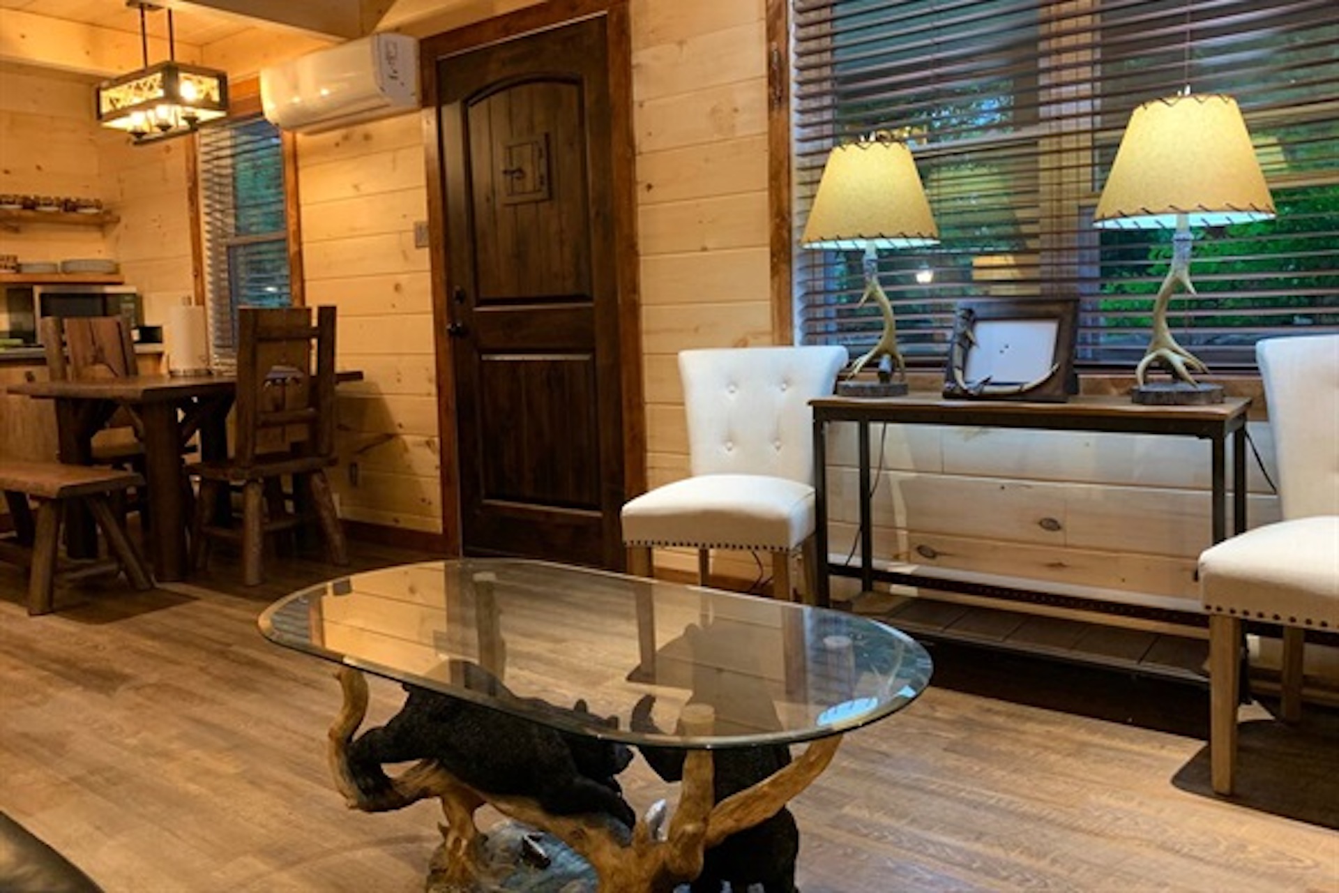 Comfortable sitting area with sofa, fireplace and large windows