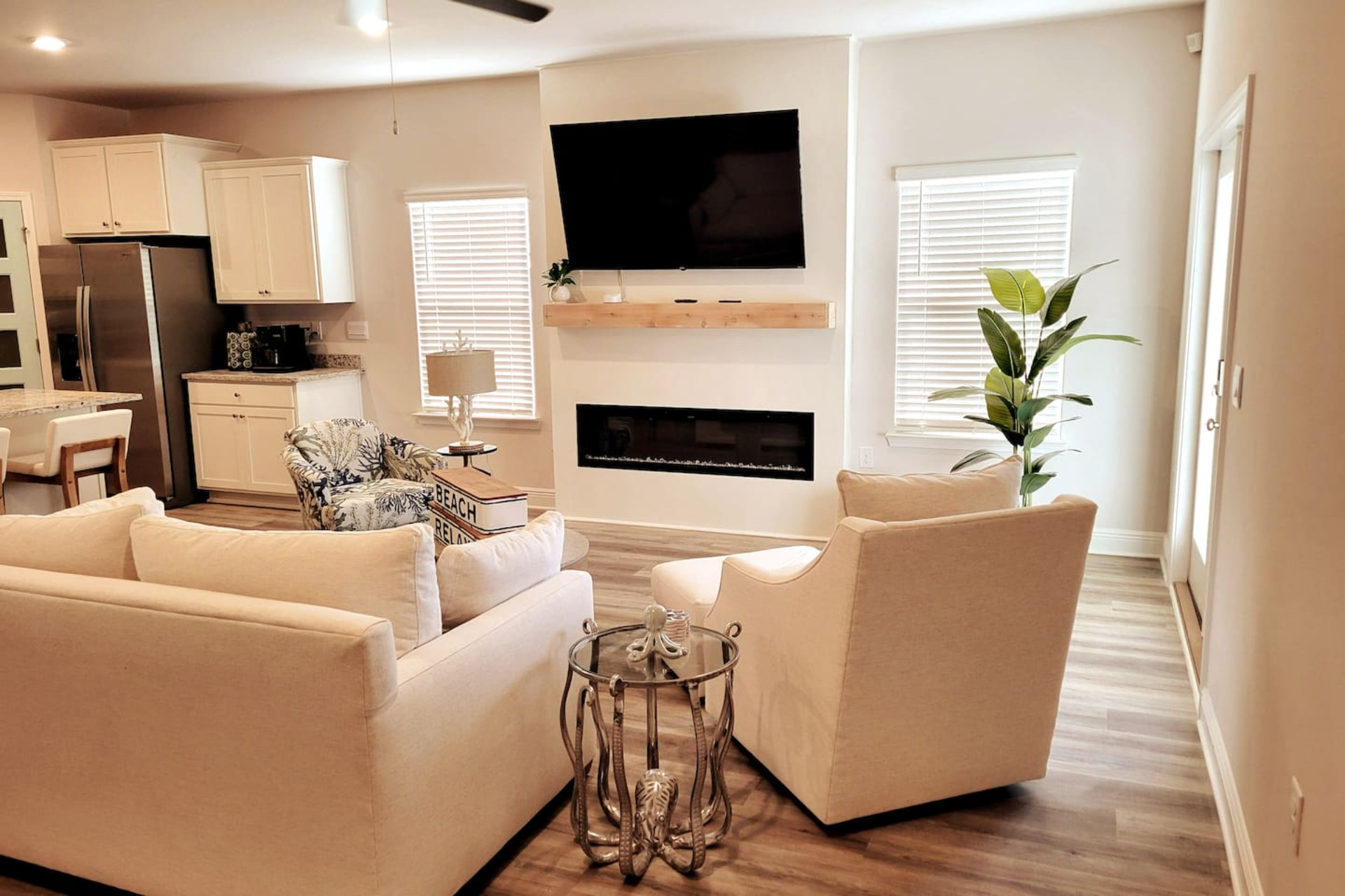 Cozy centered sleeper sofa in the heart of the open living area—extra beds + ultimate relaxation for family beach getaways.