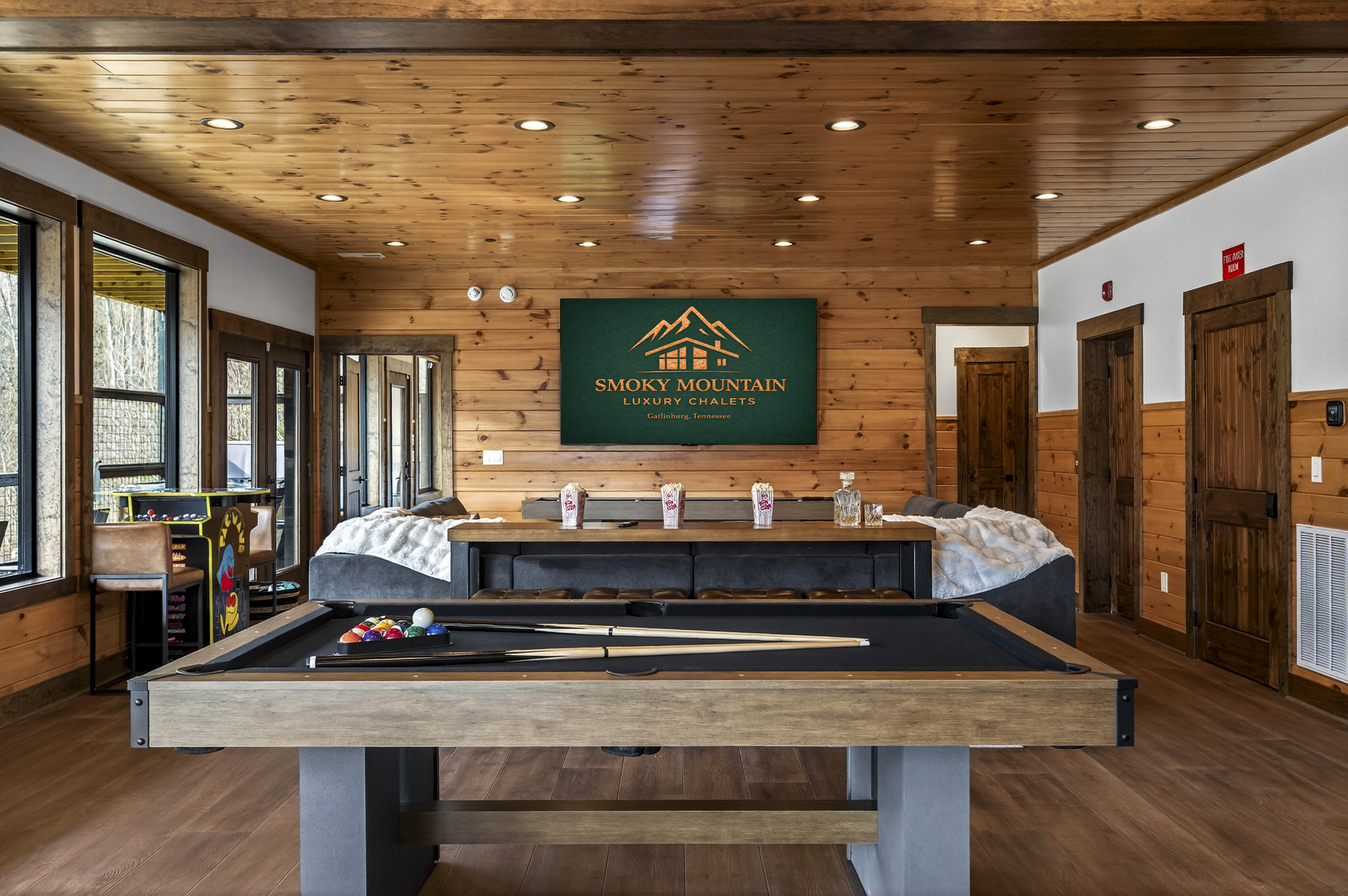 Ultimate Game Room -Watch movies or the big game on the 100-inch TV, relax on the plush sectional, or enjoy bar-top seating. Play pool, shuffleboard, foosball, and arcade tables, with a kitchenette for snacks and drinks—perfect for family fun & game nights