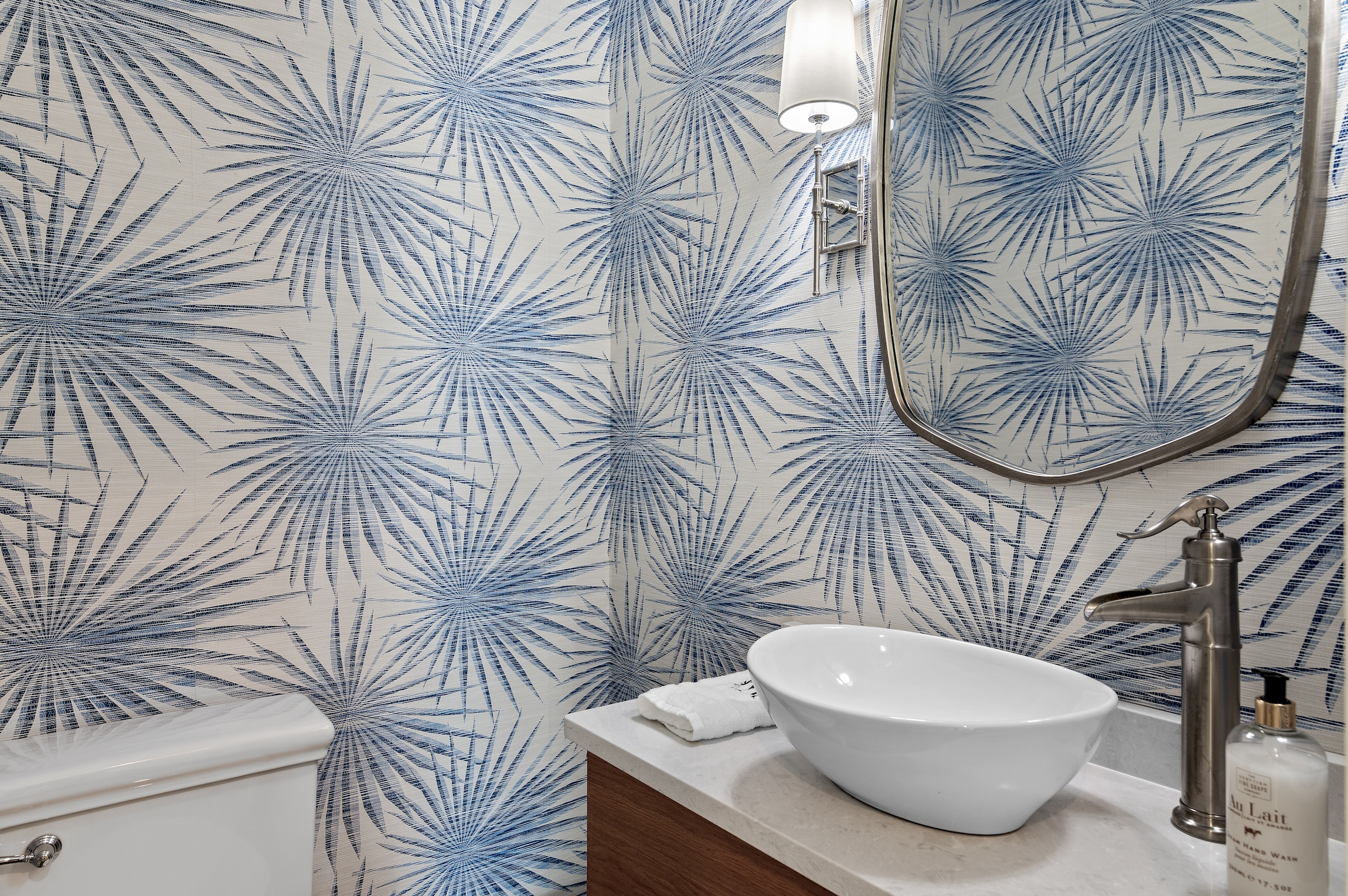 Bold wallpaper accentuates this perfectly placed powder, just off of the elevator on the third floor.