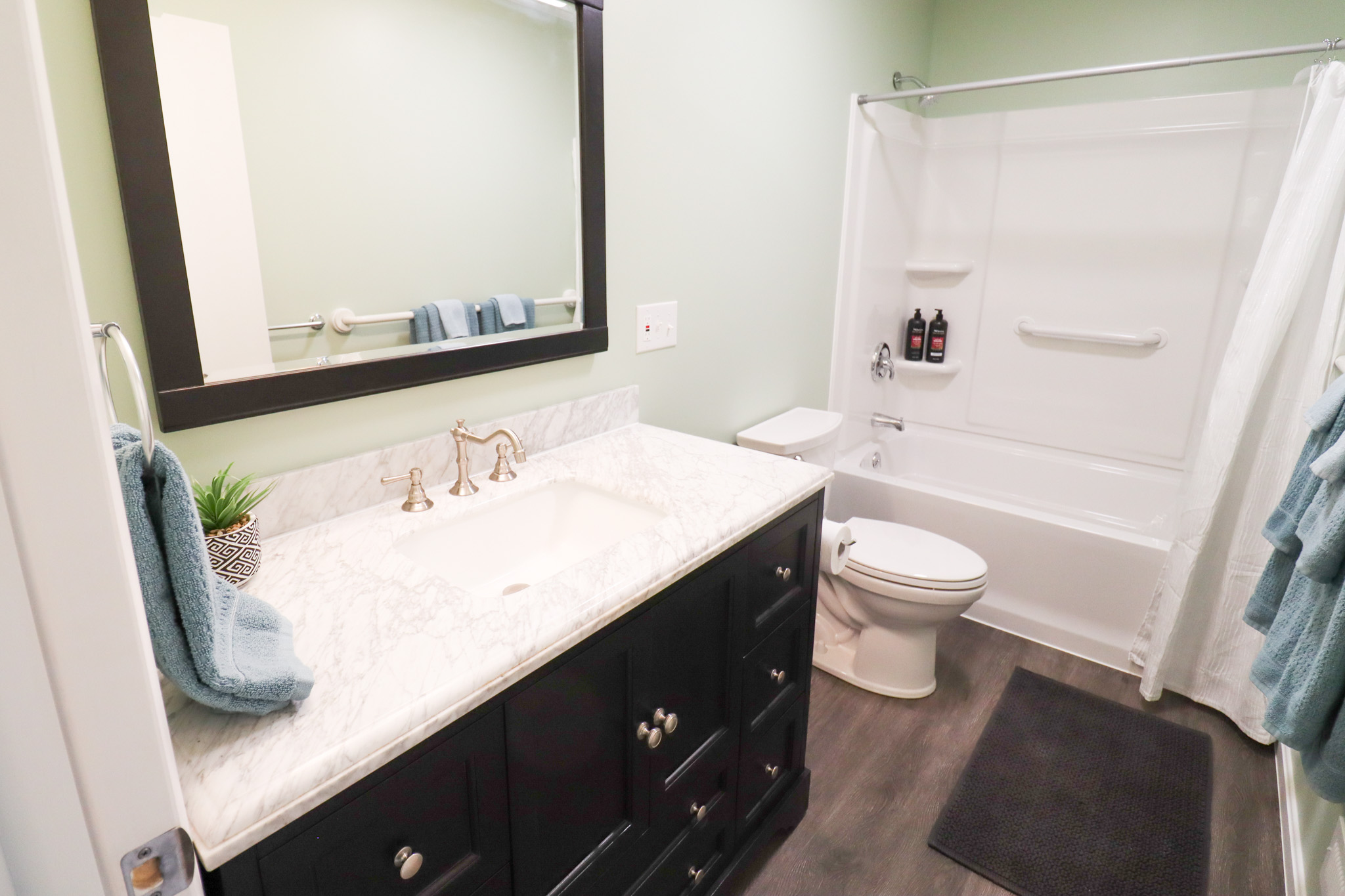 Full bathroom with tub and shower