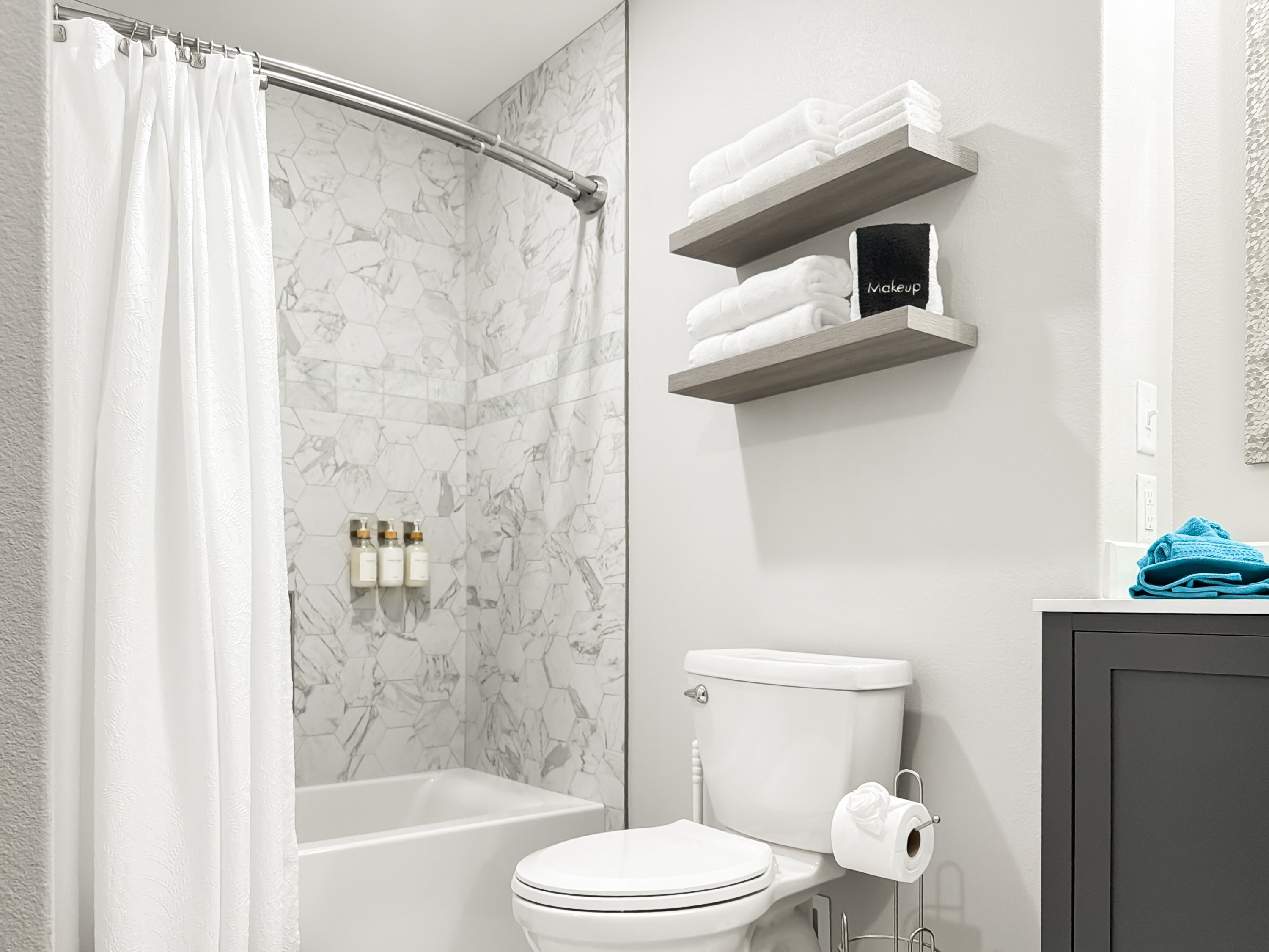 The bathroom has a shower/tub combo.