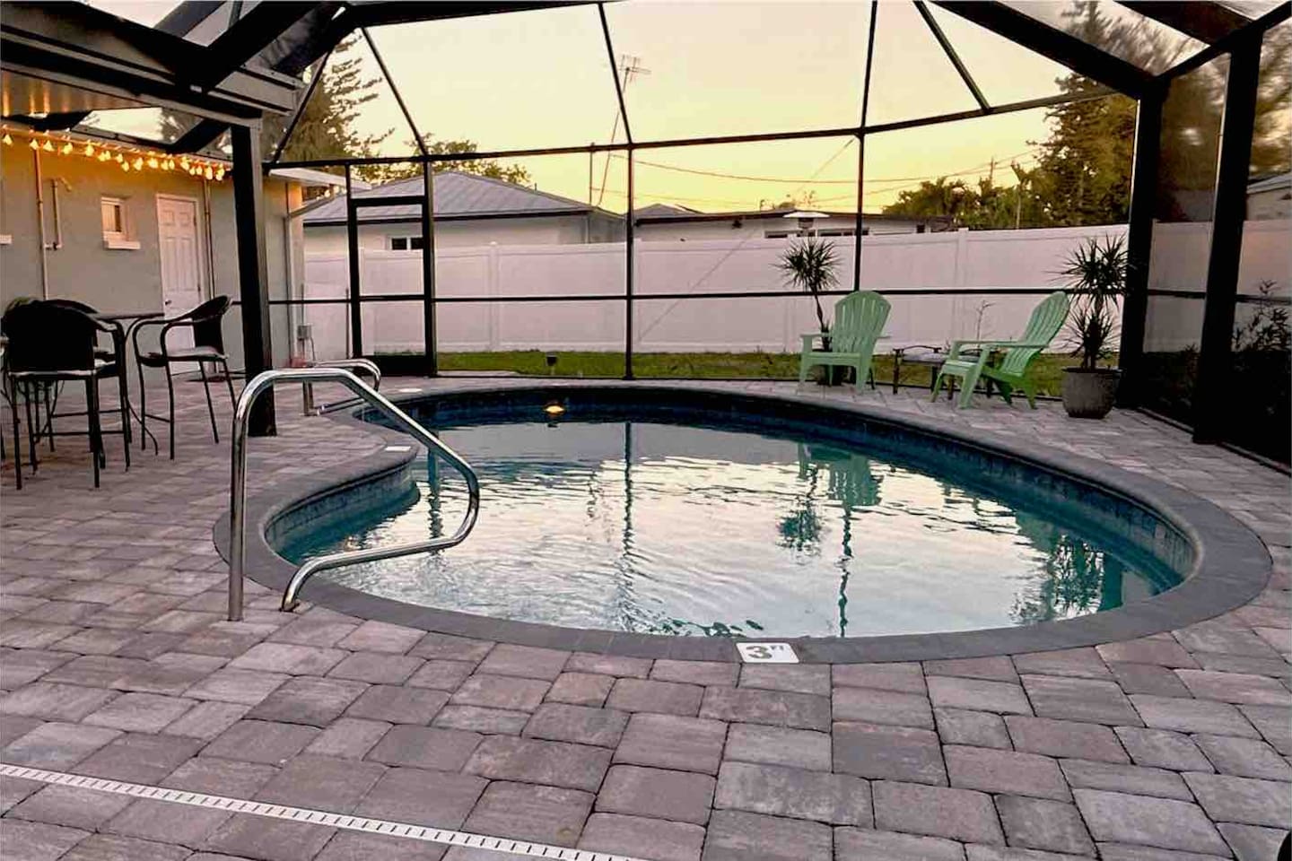 Pool Deck in the evening, enjoying the heated pool in your fully private backyard