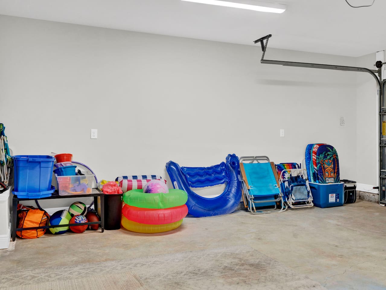 Beach chairs, floats, boogie boards, sand buckets and toys