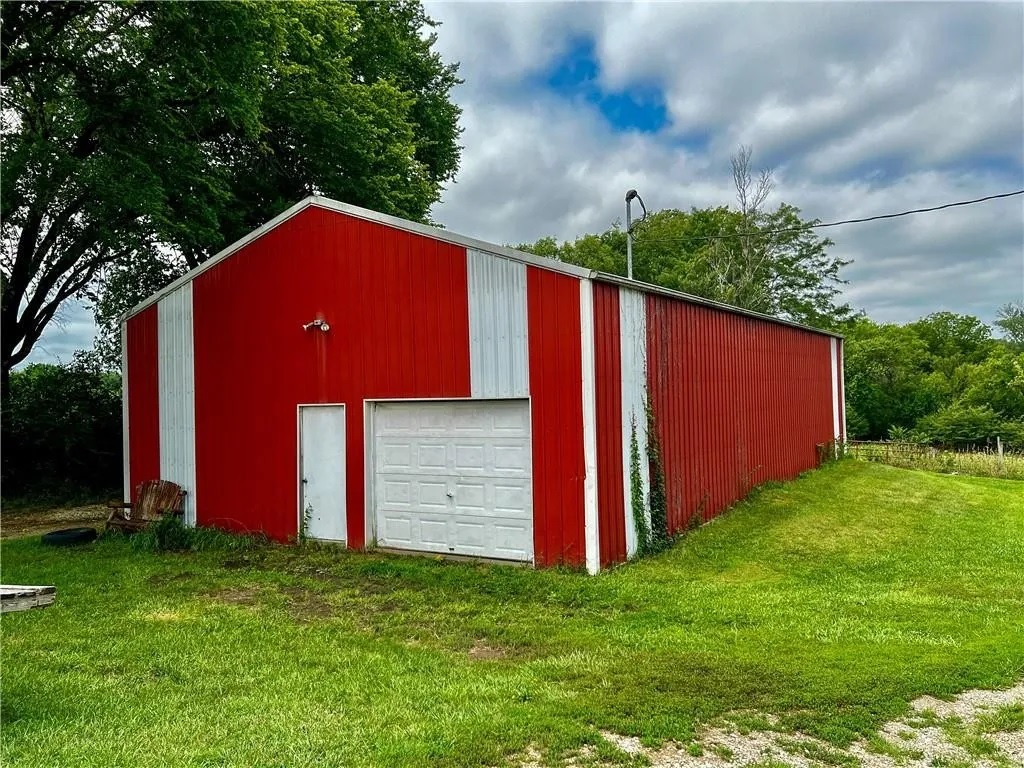 This red outbuilding is part of the property’s working farm setting and adds to the authentic country atmosphere guests experience during their stay.