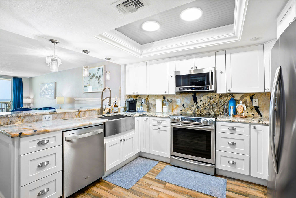 Fully stocked kitchen with beach view, everything you need to make meals with family. 