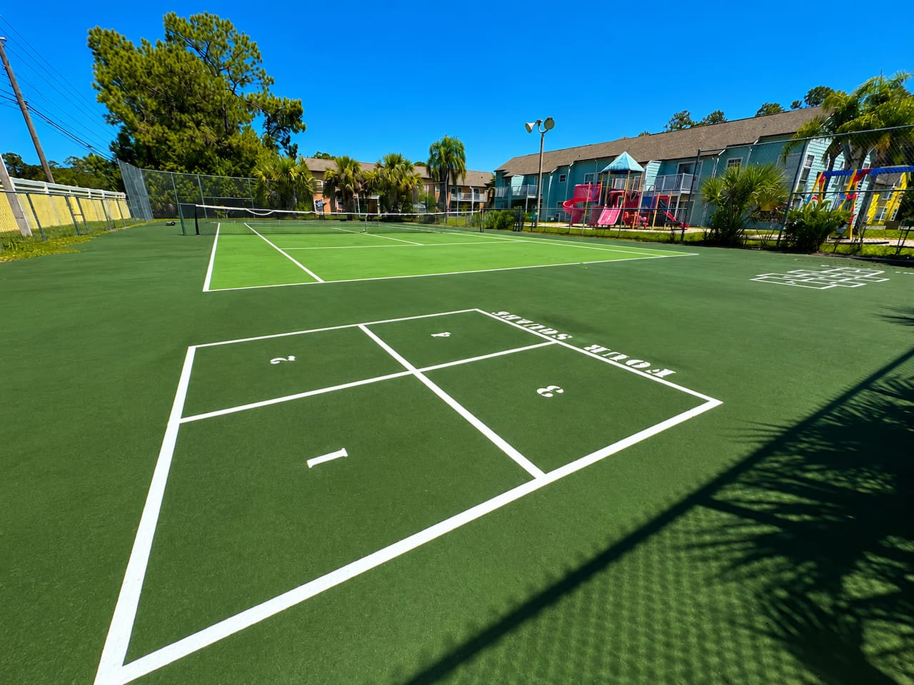 Multi-use community sports court with space for tennis and pickleball.