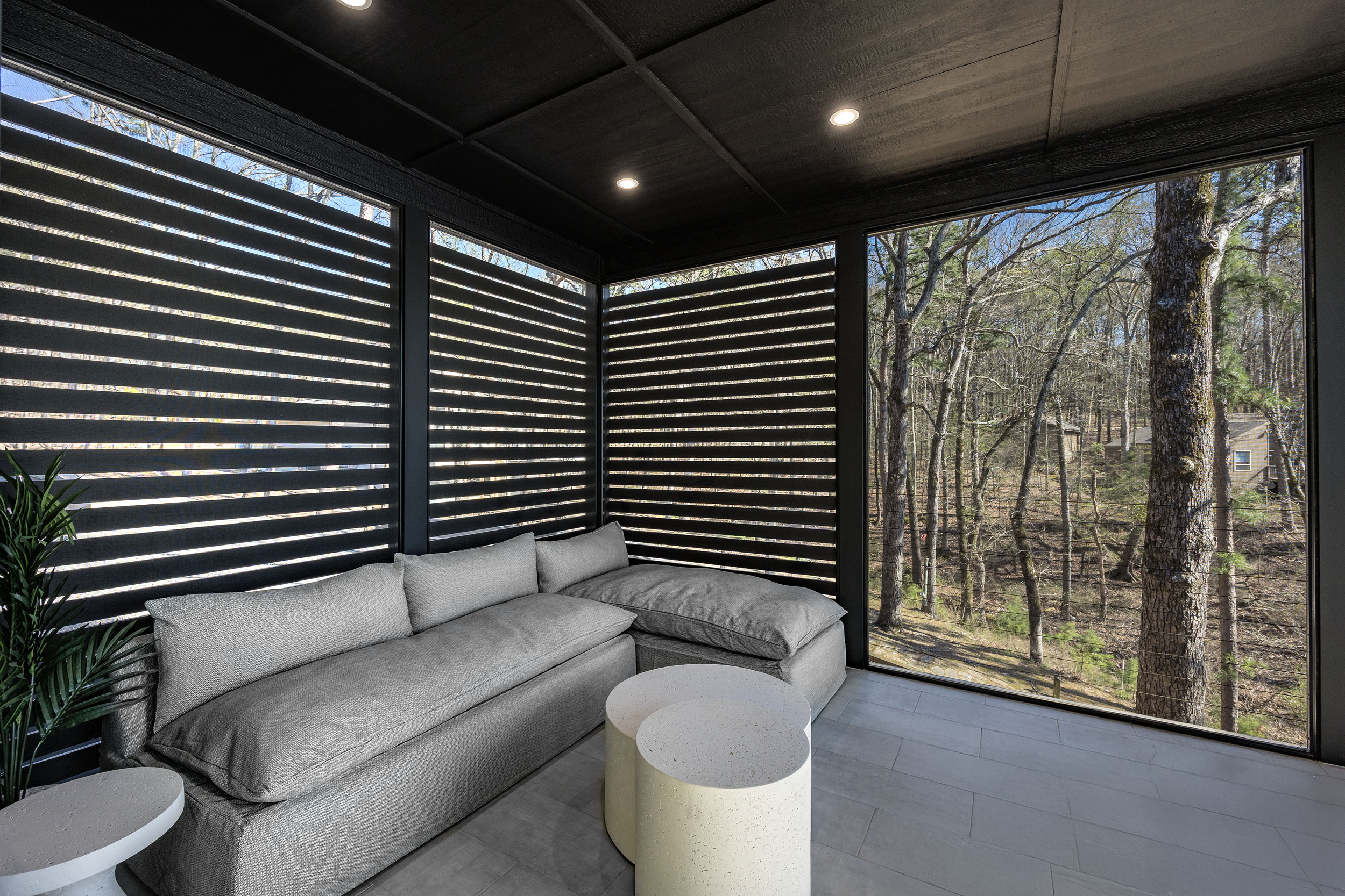 Soak in stunning lake views from the cozy screened-in porch, a peaceful retreat no matter the season.