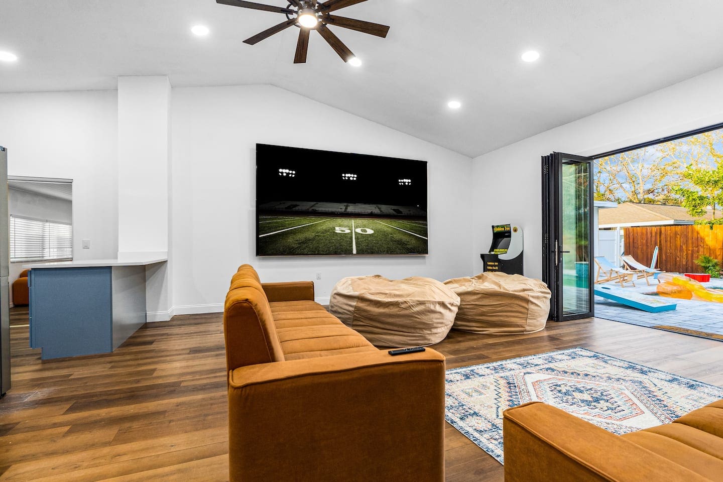 Game Room with 150-inch Screen open to Heated Salt Water Pool 