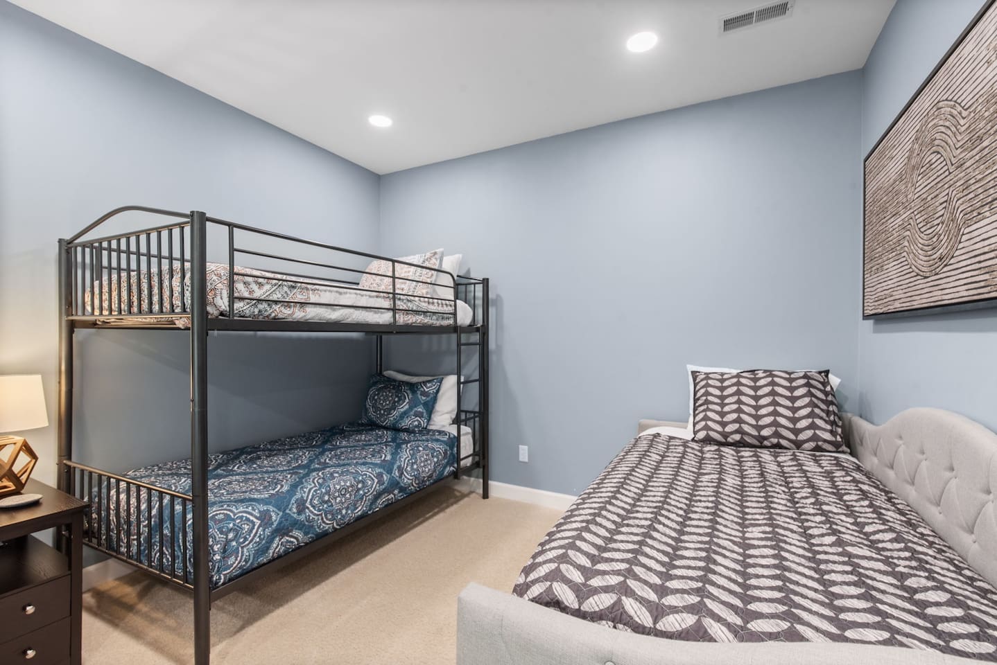Twin bunk bed and twin daybed with a twin trundle